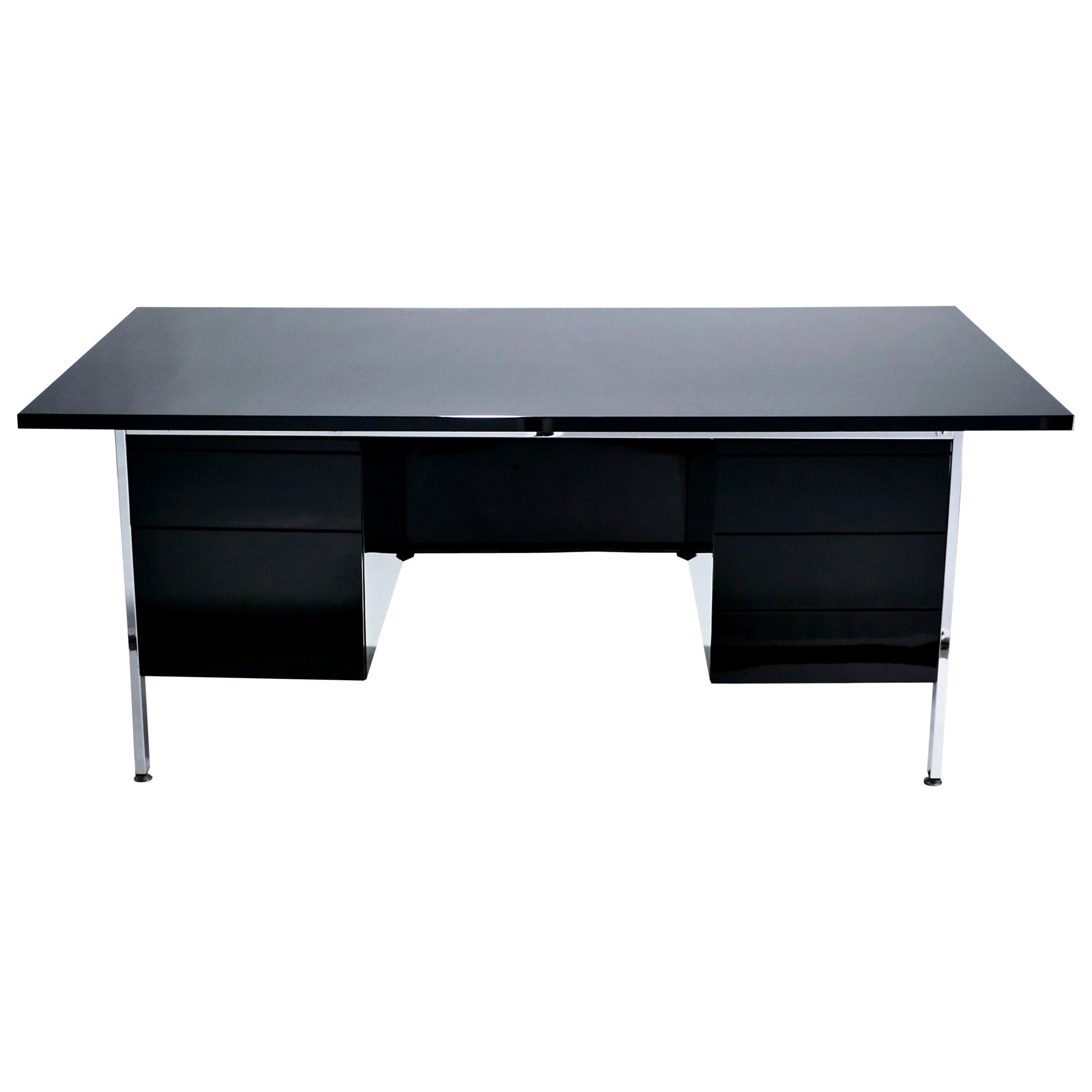 Perfect Mid-Century Modern proportions, designed by Florence Knoll for Knoll International in 1955, this desk model 1503 has a decidedly vintage mood. The black lacquer surfaces and chrome feet and accents look contemporary enough for the piece to