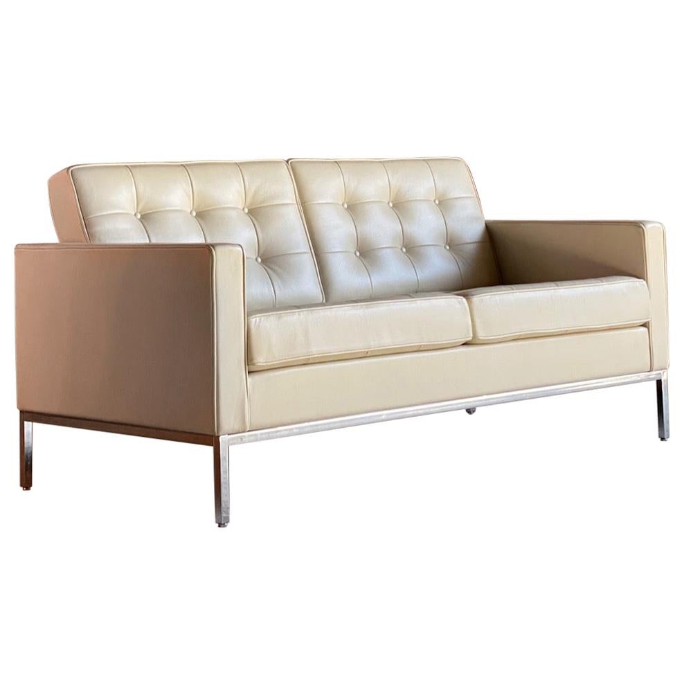 Florence Knoll leather sofa by Knoll Studio

Sublime quality Florence Knoll for Knoll Studio model 1205S2C leather two-seat sofa, the chrome frame supporting the finest cream Spinneybeck HT513 leather button upholstered seats, this is an
