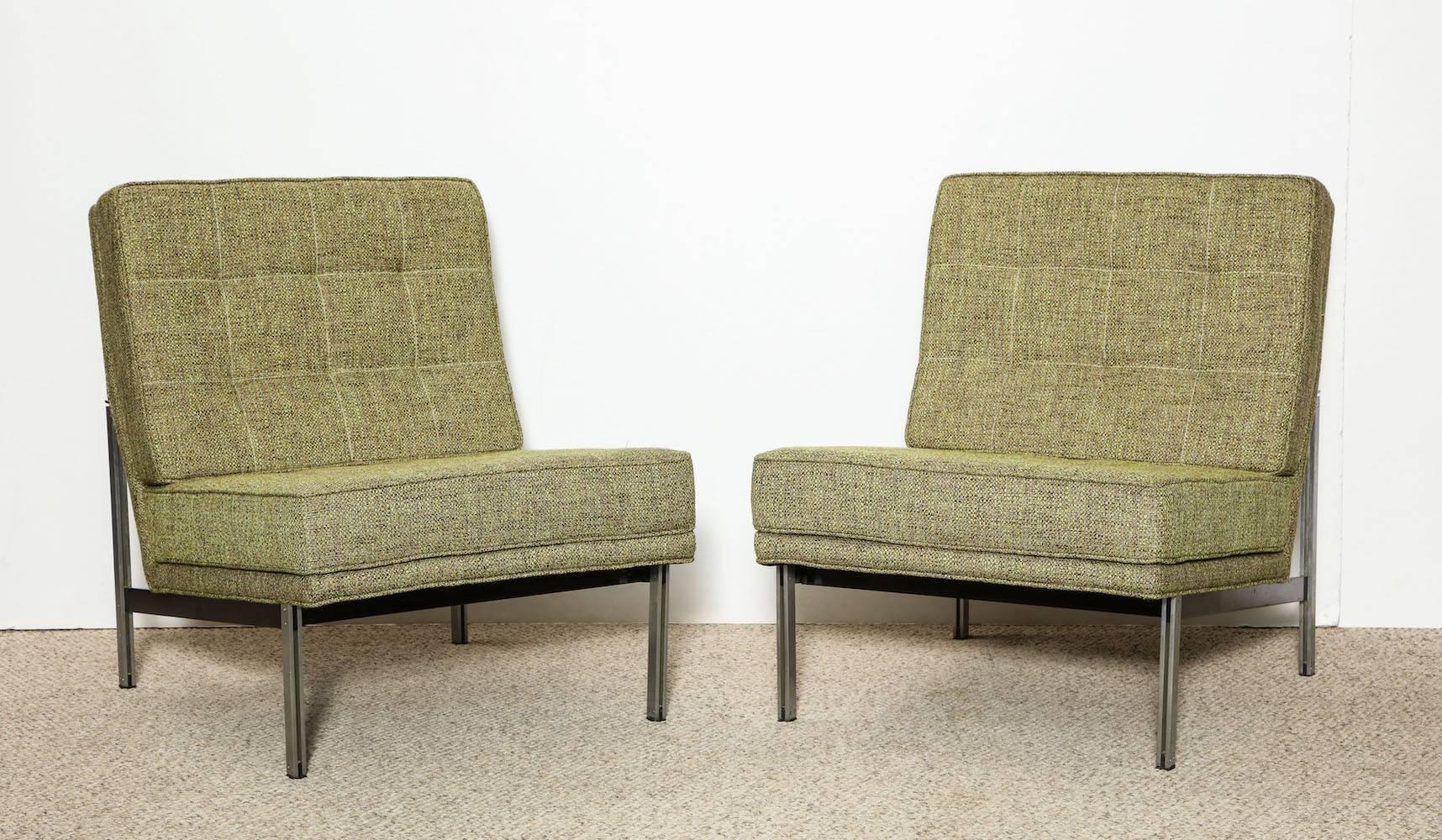 Pair of parallel-bar lounge chairs by Florence Knoll.
Steel-framed cradles with upholstered seats and backs. An American midcentury Classic.