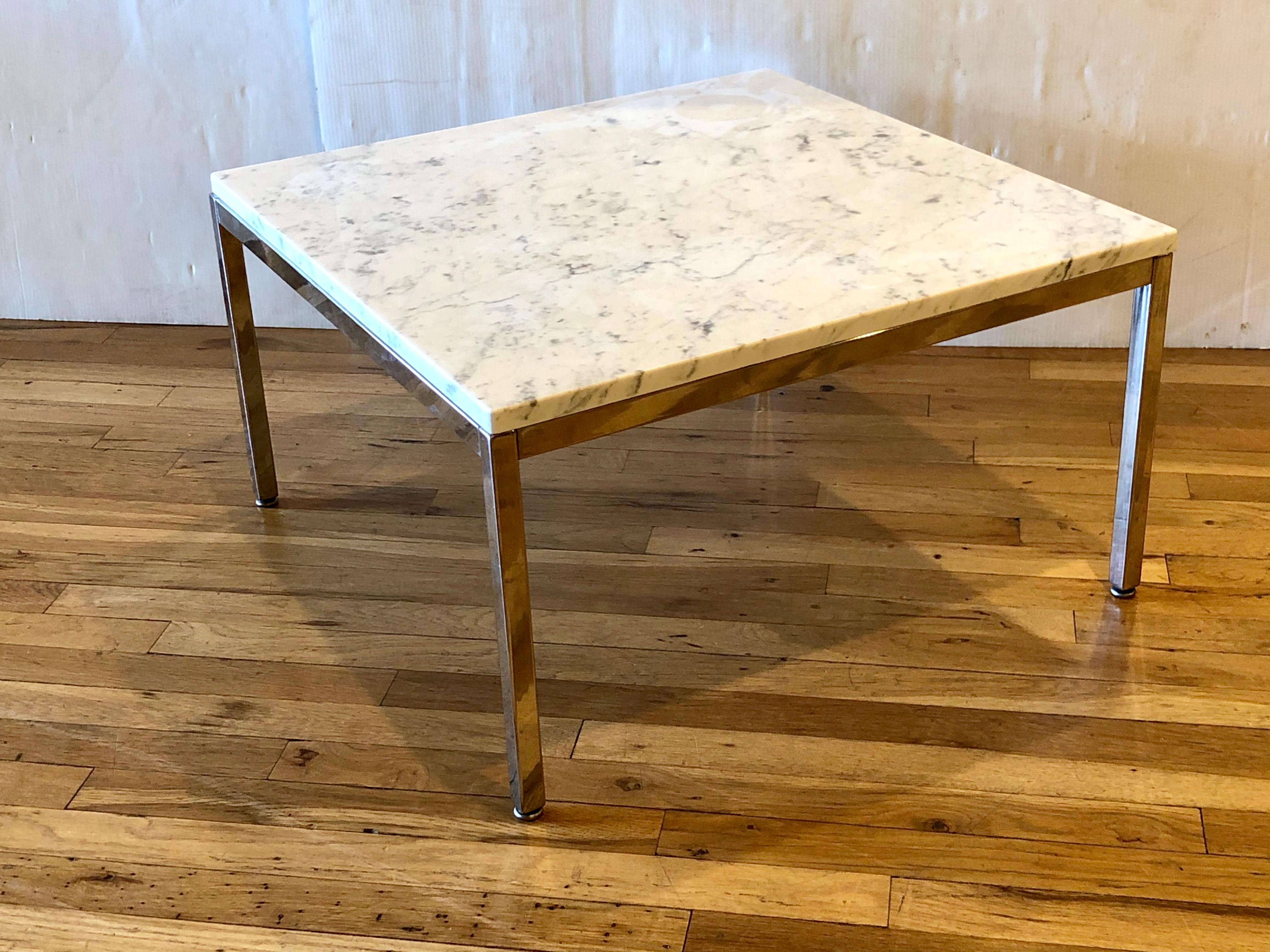 Beautiful simple elegant polished white Italian marble. On square polished chrome base designed by Knoll, this table has many uses in between 2 chairs as small coffee table, its simple and elegant we have polished the chrome and the marble top sits