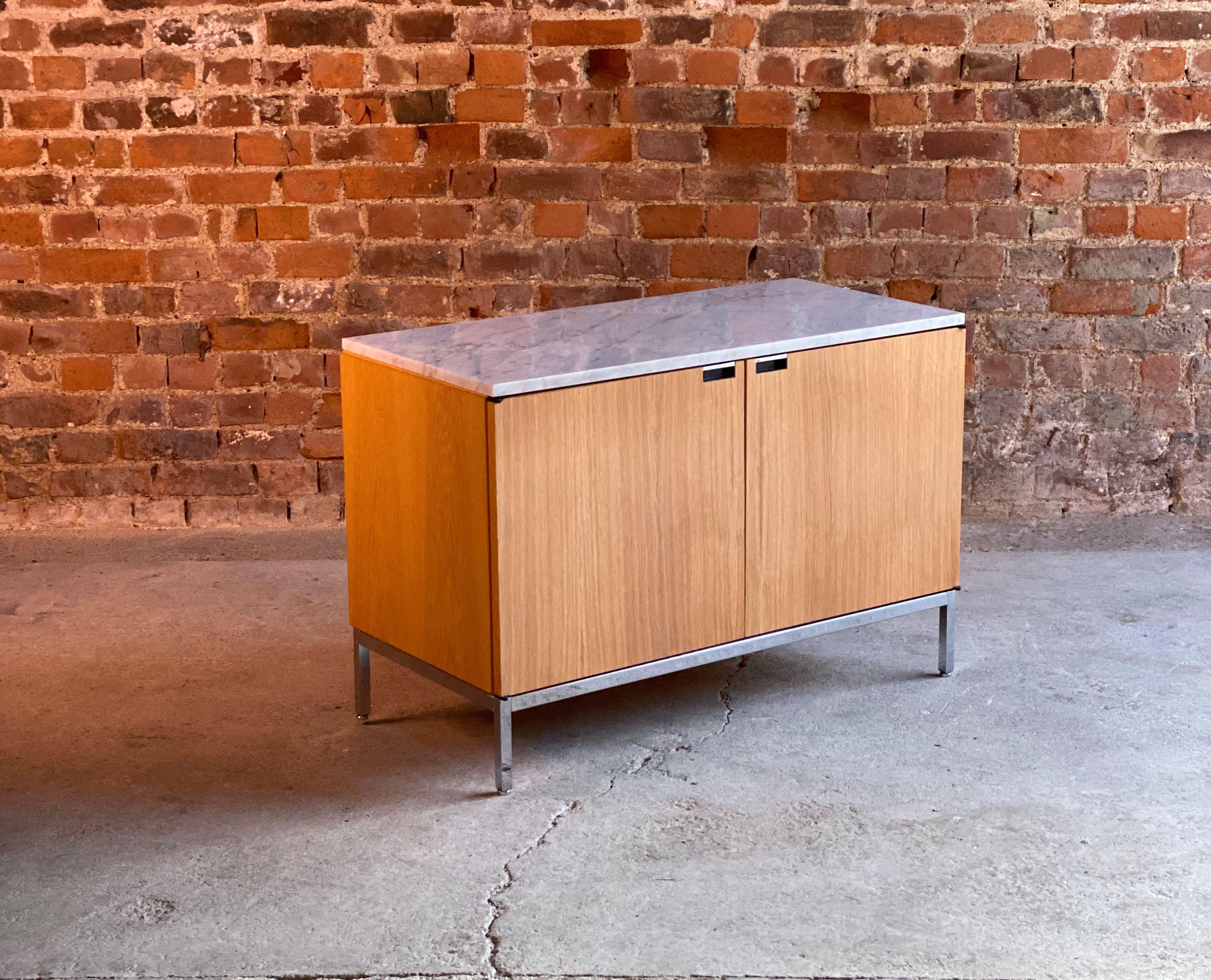 Florence Knoll Marble Credenza by Knoll oak two-door USA circa 1970

Florence Knoll marble topped oak two-door credenza by Knoll studio circa 1970. Th credenza is finished with rectangular white Arabescato marble top, over two doors with chrome