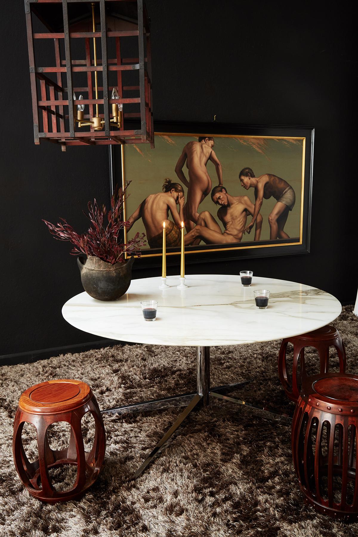 Distinctive round marble top dining table designed by Florence Knoll for Knoll International. Features a steel star shaped base covered with a chrome finish. From an estate in Hollywood, CA.