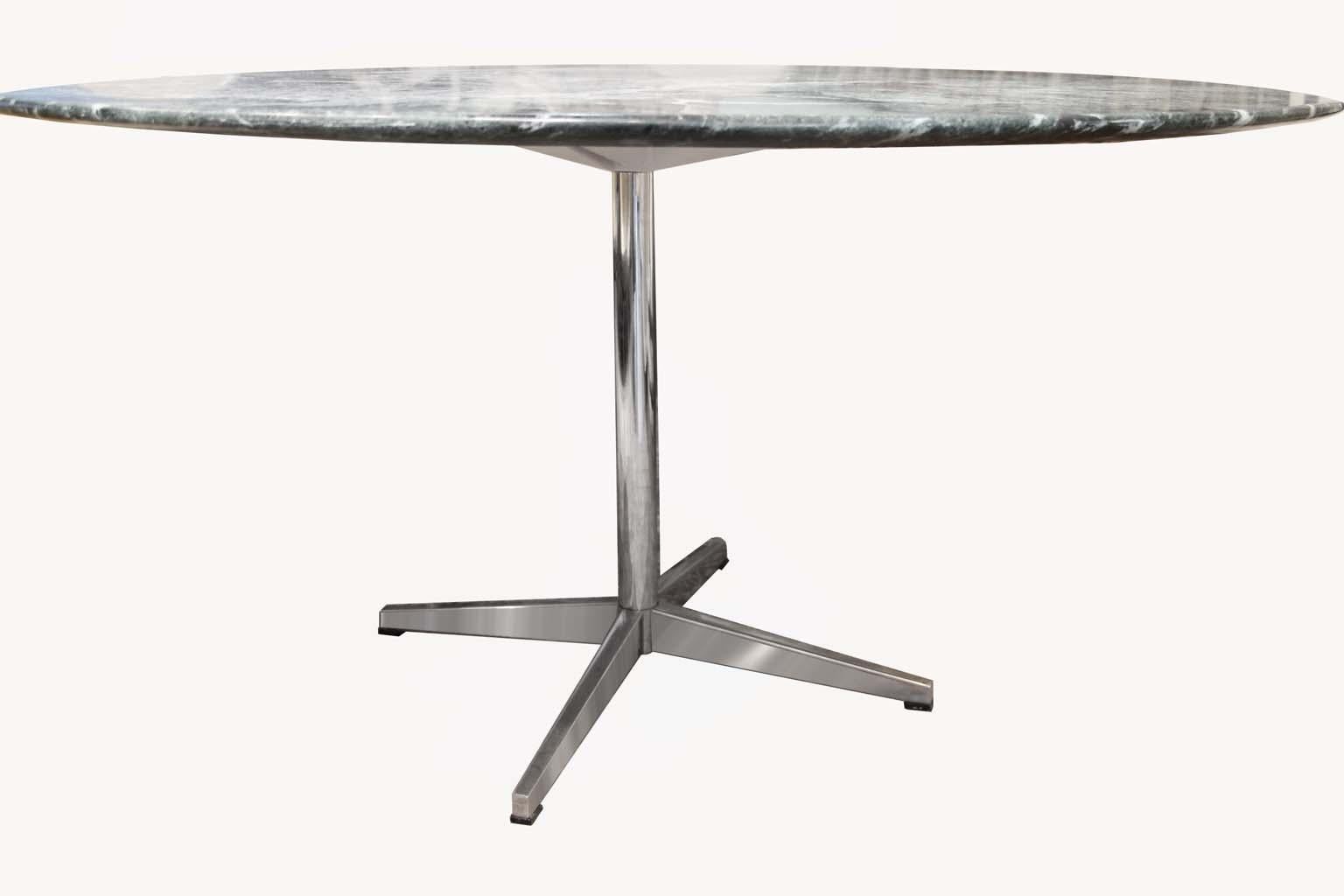 Beautiful marble-top table from the talented Florence Knoll. Heavy dense marble top with an amazing texture and color. Solid chrome base, balances perfectly below the delicate looking top. An amazing design to be so solid and hefty but look so light
