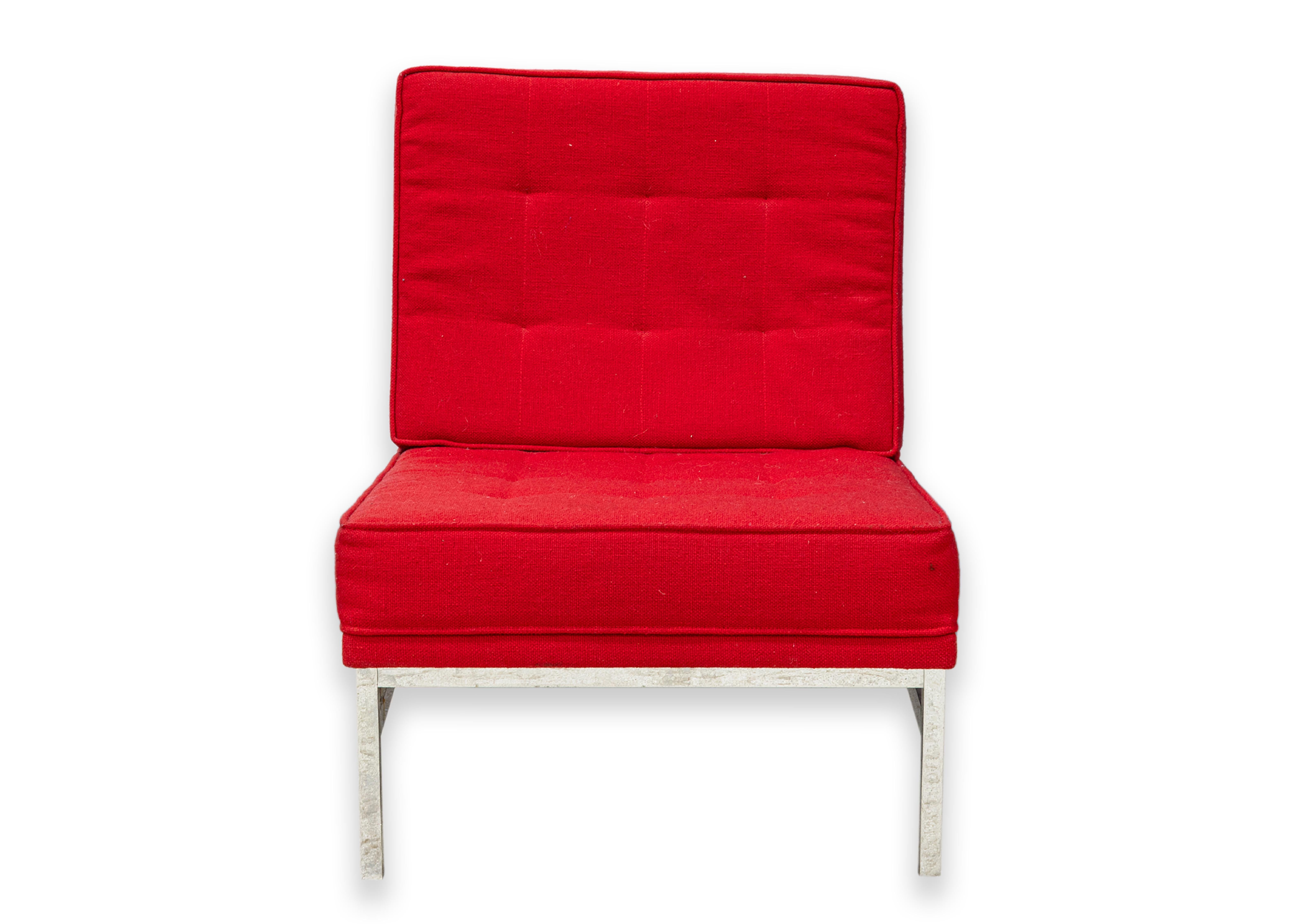 A Florence Knoll red parallel bar accent chair. A classic mid century modern design chair featuring a beautiful red fabric upholstery. This classic design features a heavy metal chrome frame with rectangular shapes. The seat sits on an angle that