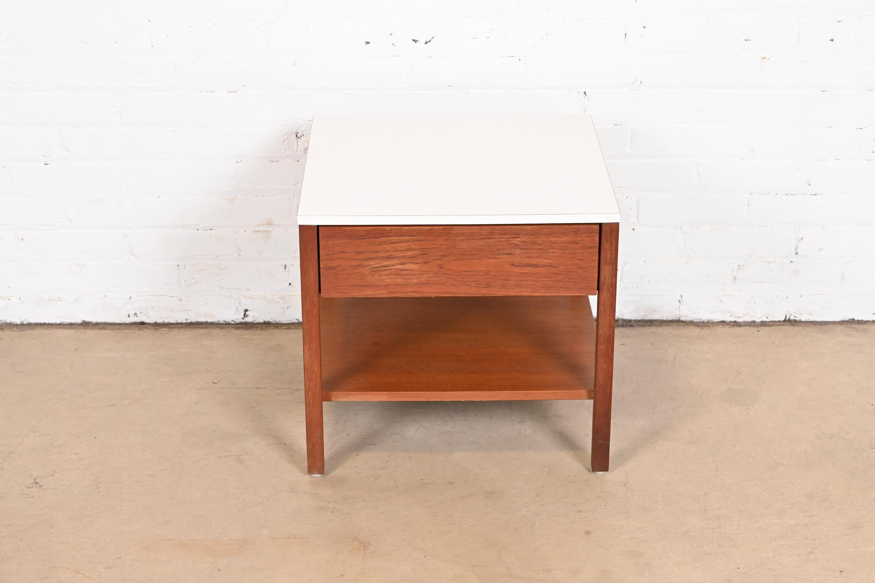 A sleek and stylish Mid-Century Modern two-tier Nightstand or side table

By Florence Knoll for Knoll Associates

USA, circa 1960s

Walnut, with durable white laminate top.

Measures: 19.5