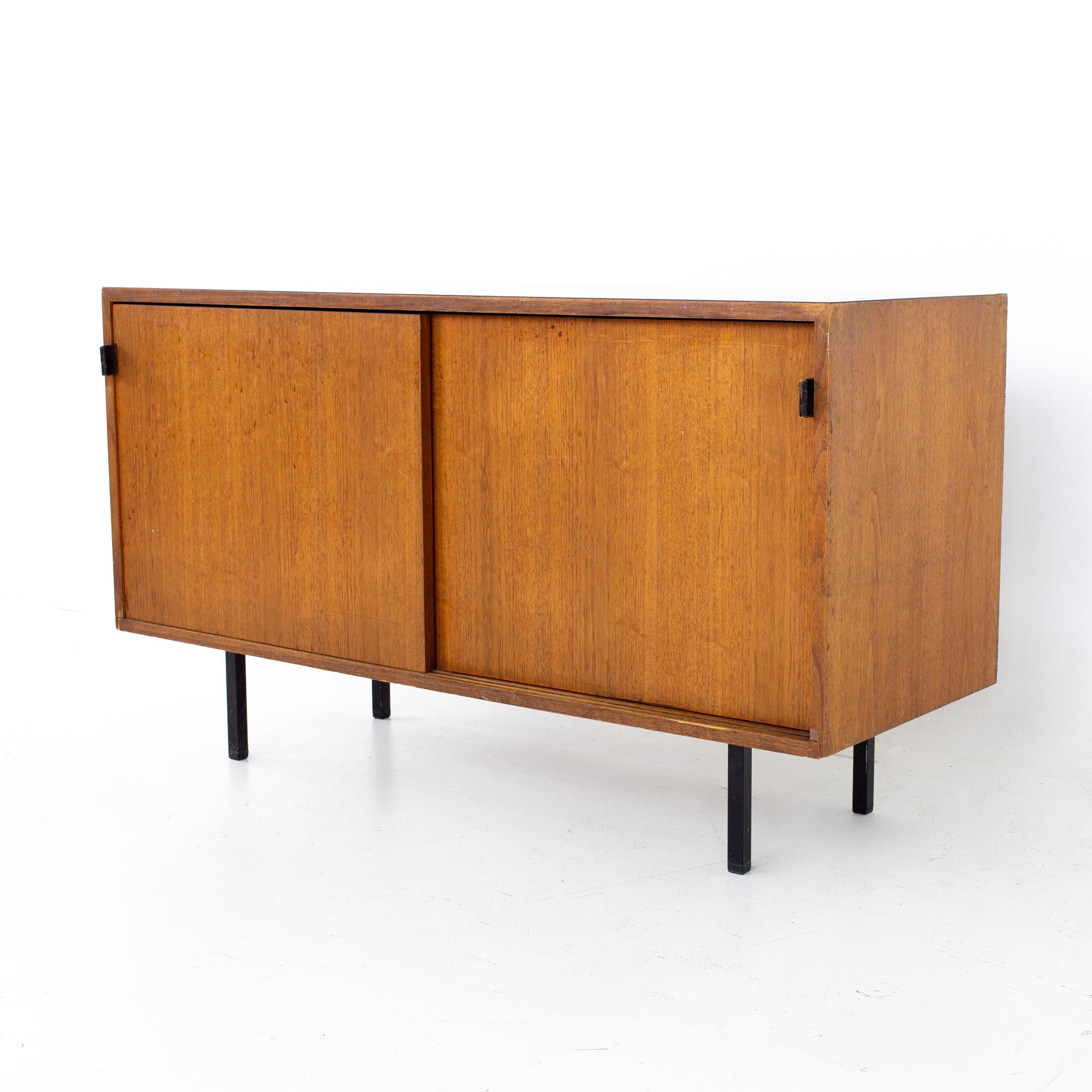 Florence Knoll mid century walnut sliding door credenza
Credenza measures: 48 wide x 17.75 deep x 28 inches high

All pieces of furniture can be had in what we call restored vintage condition. That means the piece is restored upon purchase so