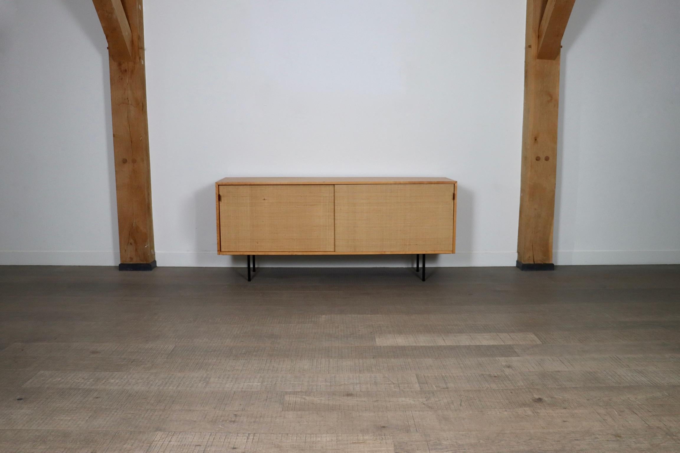 Fantastic Sideboard by Florence Knoll, model 116 in maple wood and original seagrass sliding doors for Knoll International, Stuttgart, 1950s

This breathtaking timeless design will instantly elevate any space. The stunning original seagrass sliding