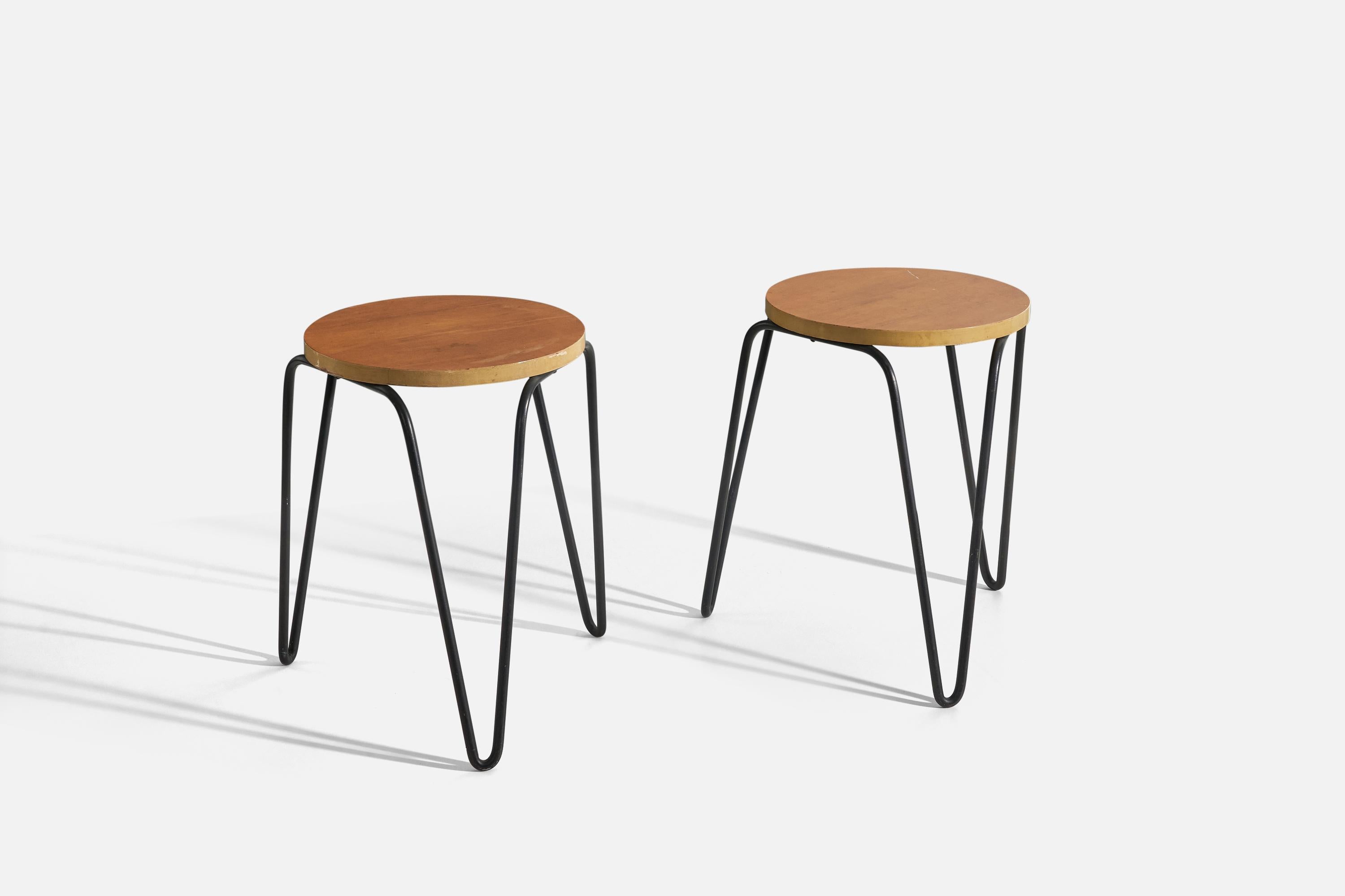 A pair of birch and iron stools, model 75, designed by Florence Knoll and produced by Knoll Associates, USA, 1948.
