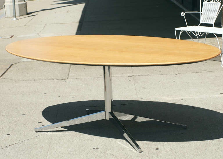 Florence Knoll-designed oak dining table. This table features a 7' foot long top and a newly re-chromed steel base. This table was also sold as a conference table.

The top was recently refinished along with the base being re-plated in chrome.

This