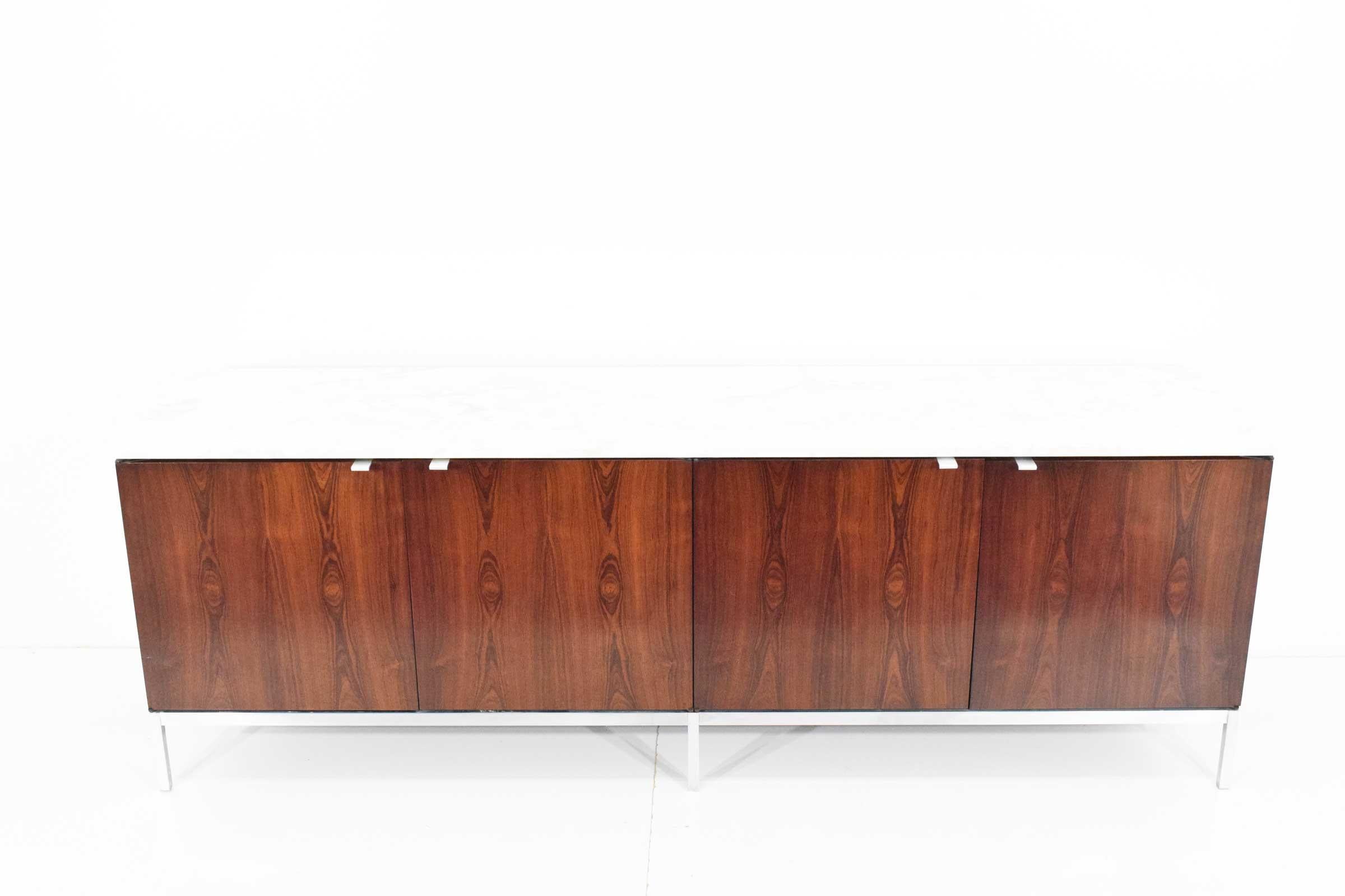 This is an early version Florence Knoll credenza, 1960s from an important architect's home. We were lucky to get two of them so see our other listing. They were in the dining room so not heavily used. Marble is beautiful. Graining is beautiful on