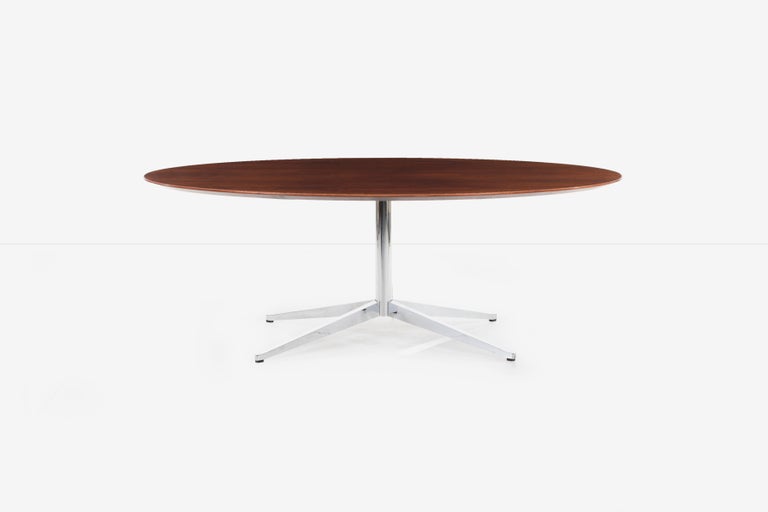 Florence Knoll rosewood dining table or desk, highly figured rosewood veneer top with beveled edge detail. Solid steel brushed chrome-plated stem and base.
[label on underside Knoll International].