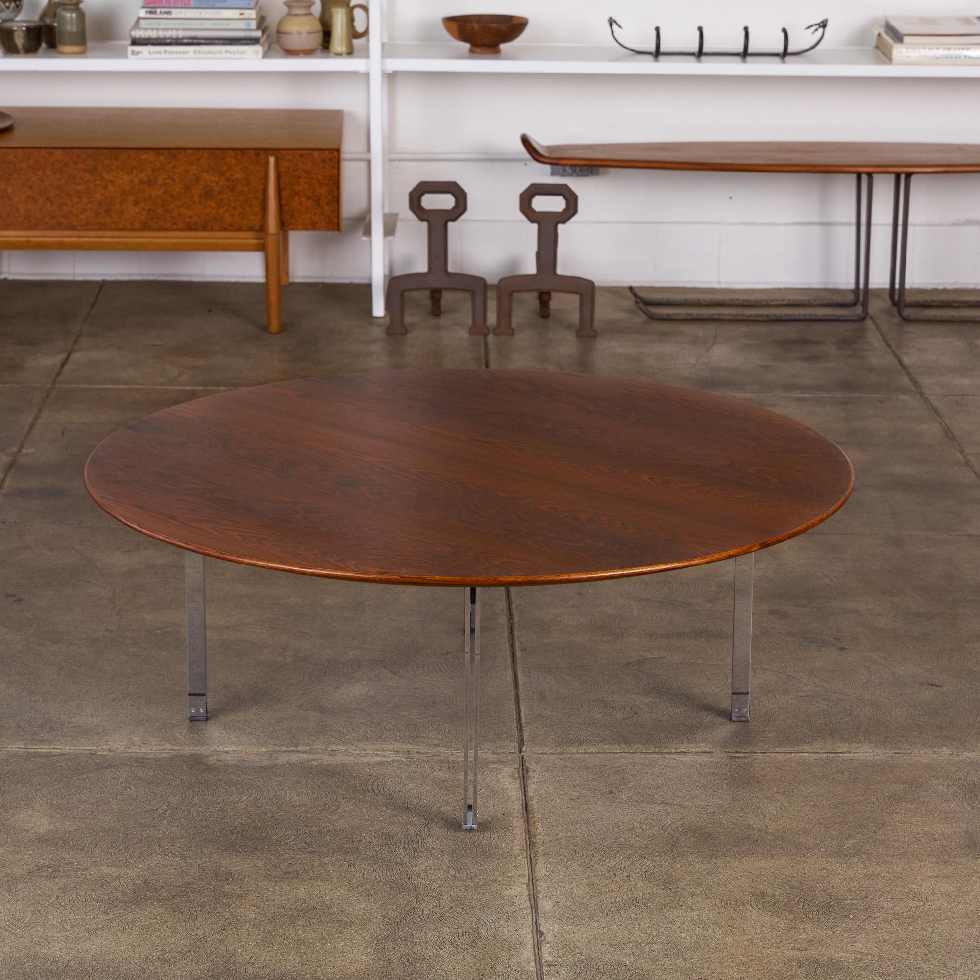 Part of Knoll’s iconic Parallel Bar series, designed by Florence Knoll. Produced from 1955-1968, this model 404 round coffee table, features richly coloured and figured rosewood veneer. Double steel brushed chrome legs (hence its name) complete the