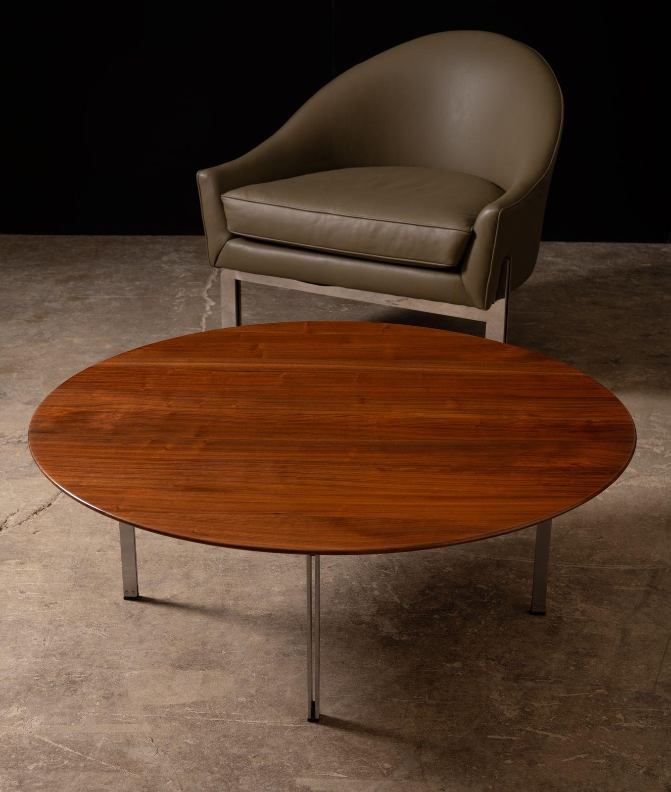 Early production Florence Knoll designed parallel bar cocktail table with a solid wood top and satin steel legs.
Restored to the highest possible standard.
Very heavy and substantial.