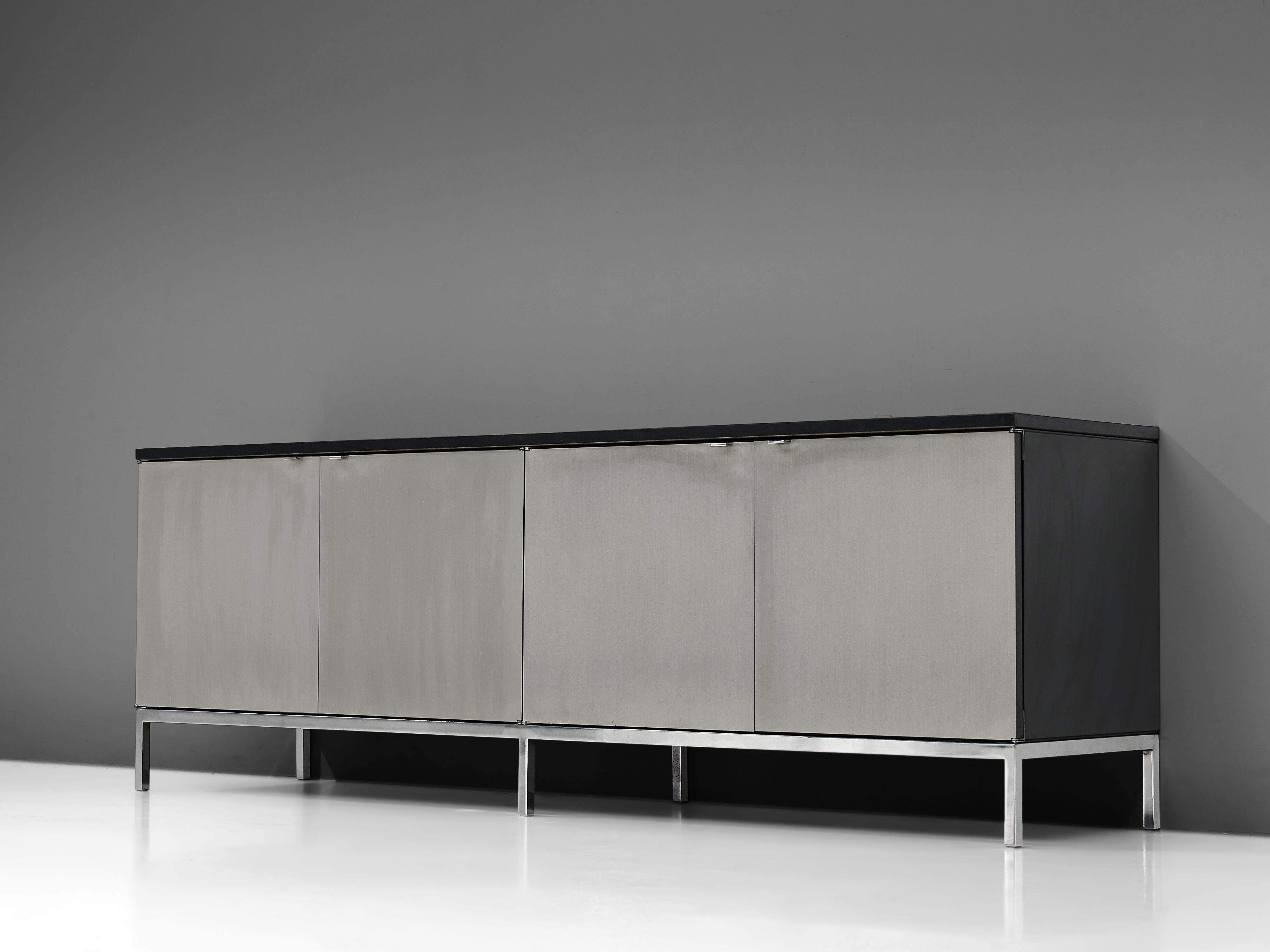 Florence Knoll for Knoll International, credenza, ebonized oak, brushed steel, United States, designed in early 1960s

Large credenza with a chrome base designed by Florence Knoll for Knoll International. This exceptional and minimalistic designed