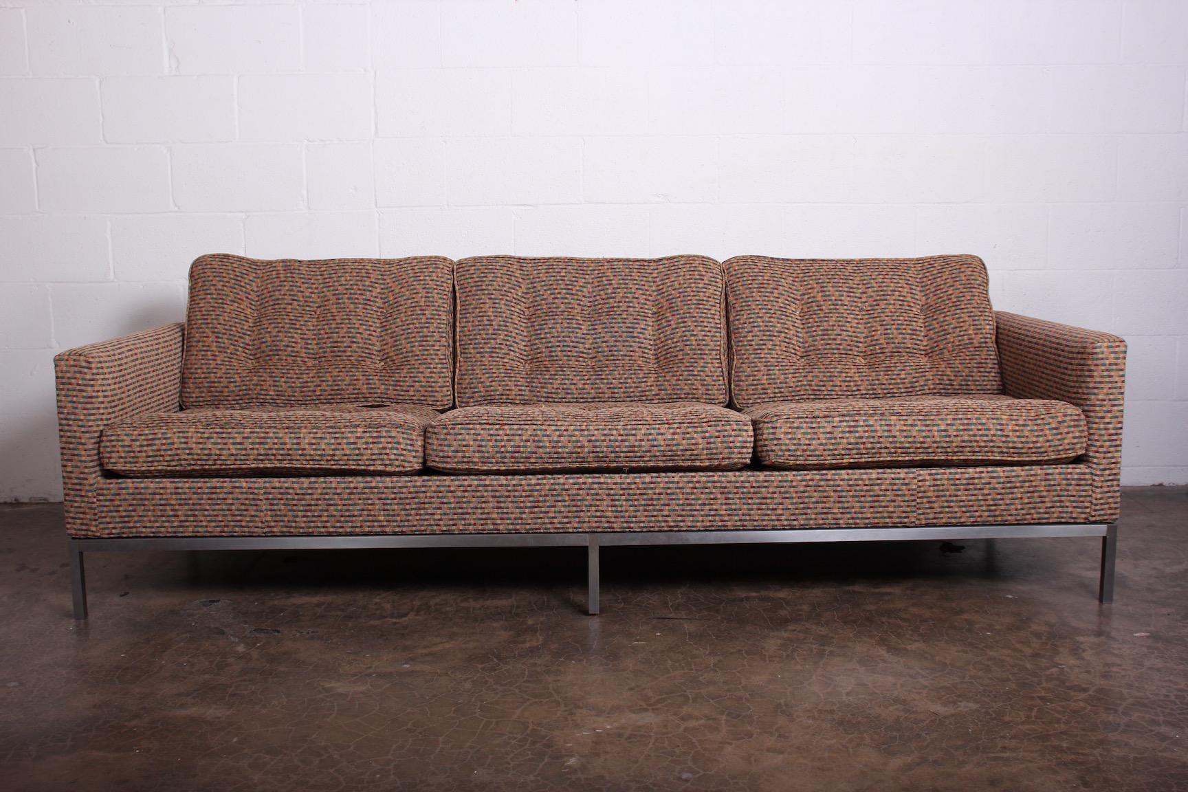 An early Knoll sofa with brushed steel base designed by Florence Knoll.
