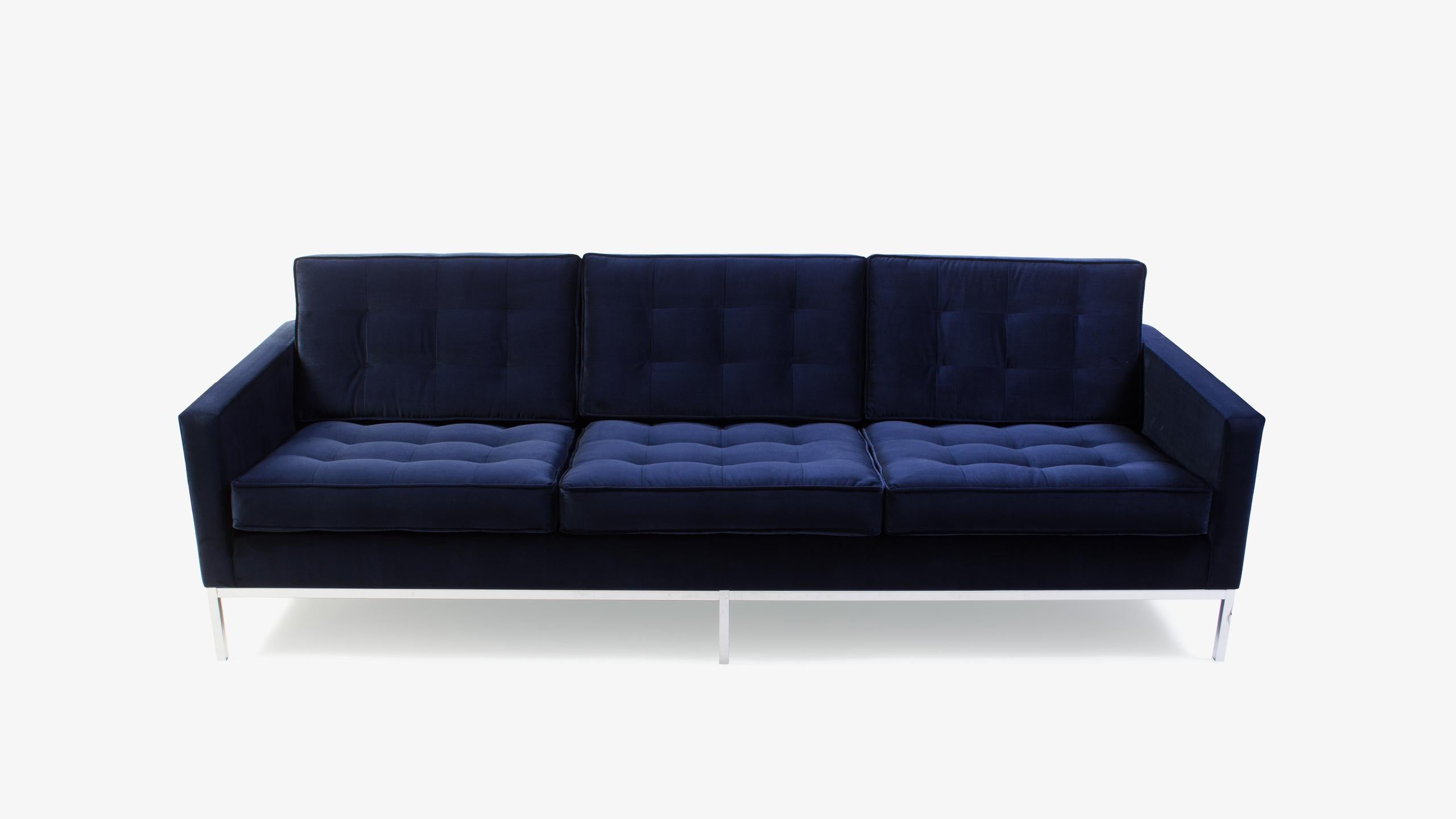 The Classic Florence Knoll sofa, completely restored and reupholstered in navy blue. We restored this piece based on original specifications. Using a high quality supple deep navy velvet, the piece has been brought back to life to live on for