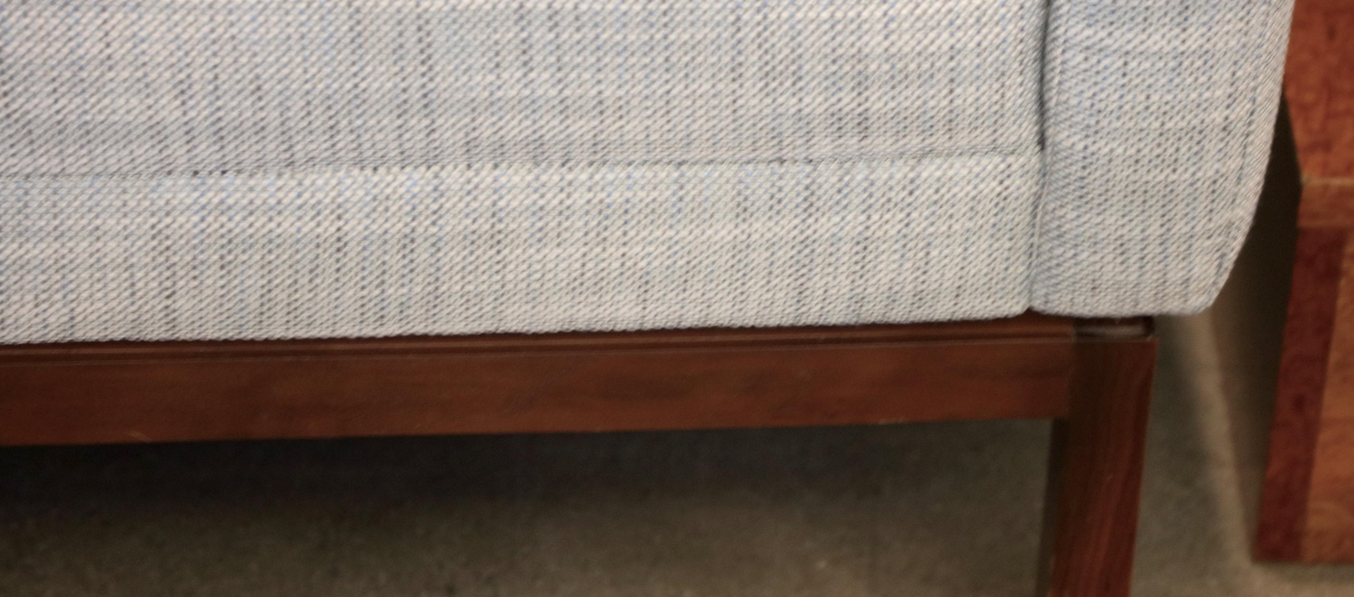 A Florence Knoll sofa from the 1960s redone and re-upholstered. Not Labelled, but was marked before upholstery. There are some minor marks to the walnut base.