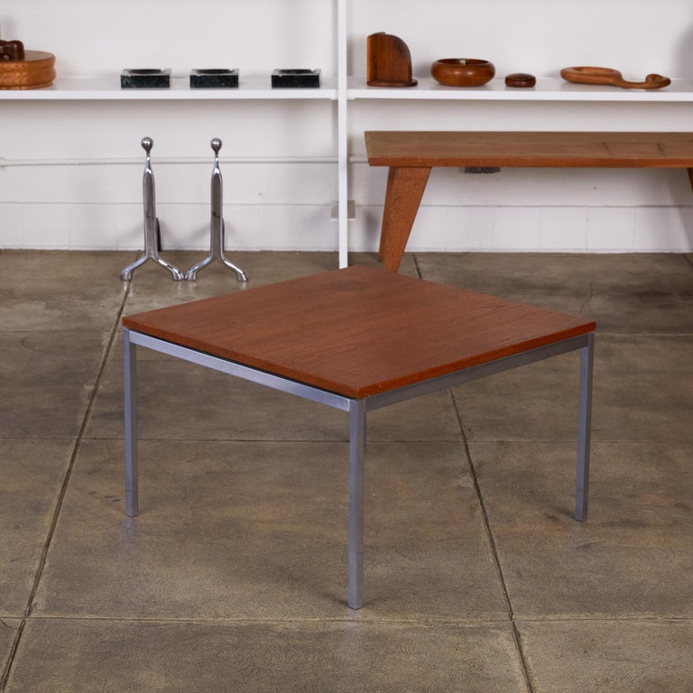 Designed by Florence Knoll in the 1950s, this simple coffee table has four square legs of chromed steel. The square tabletop sits flush with the frame and is made of a walnut veneer. It is a perfect example of Florence Knoll’s sharpness and