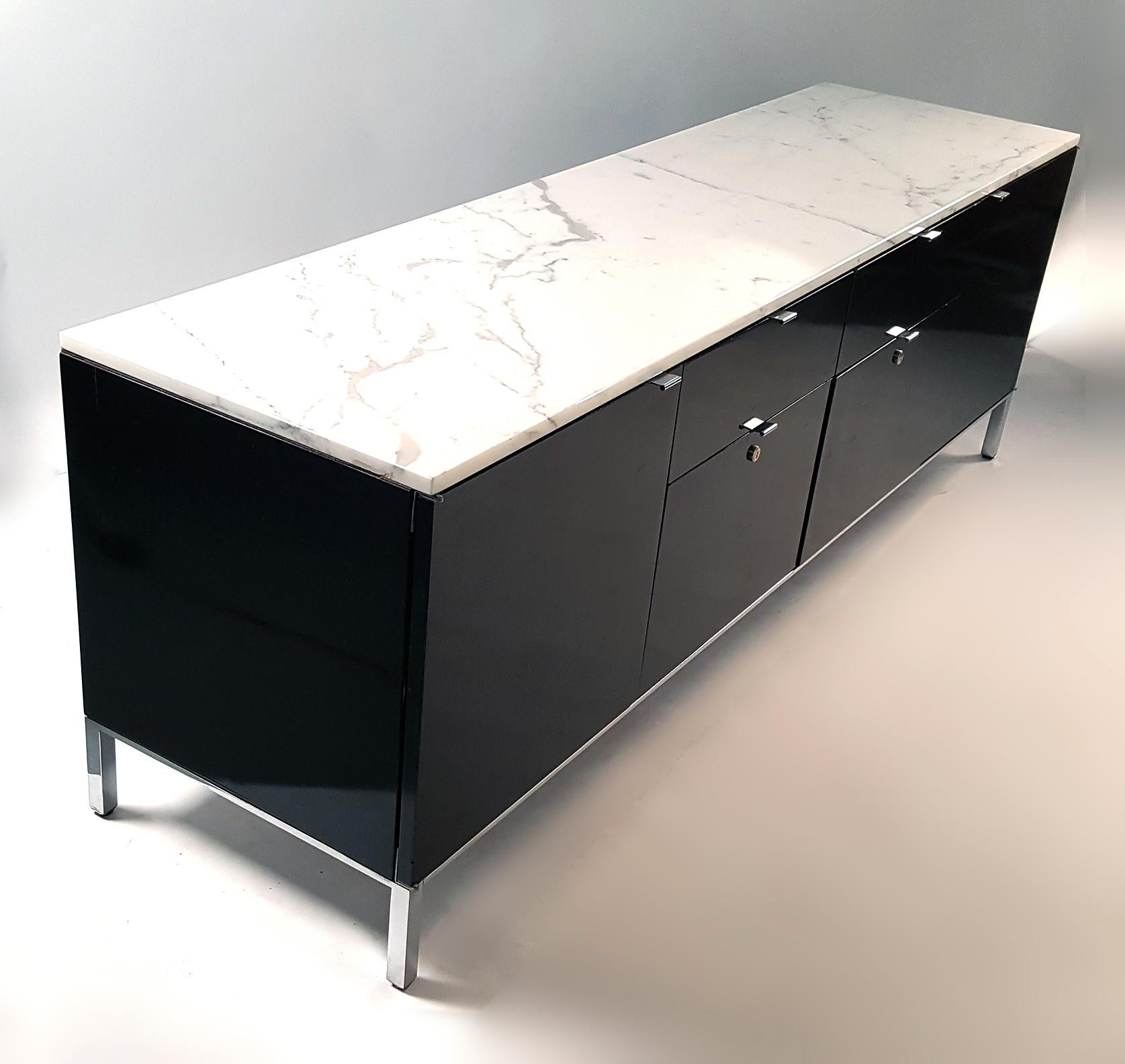 Beautiful credenza with matching file cabinet designed by Giacomo Buzzittan for Stow Davis. The matching set has Carrara marble tops, black lacquer cabinets with chromed steel bases and drawer pulls and will work great in any modern environment. The