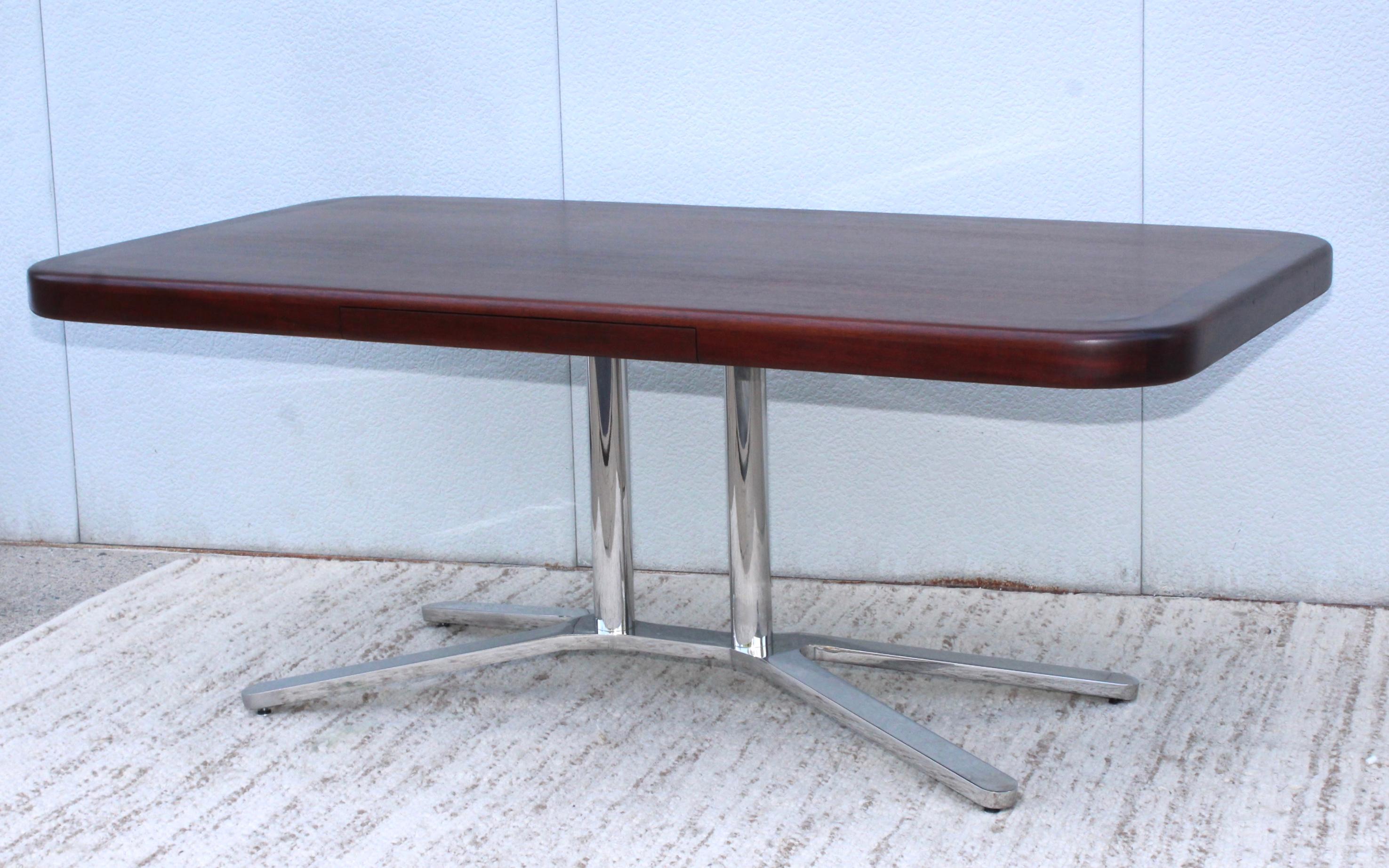 Stunning 1970s steel base with mahogany top executive desk in the style of Florence Knoll. The base is solid steel covered chrome.