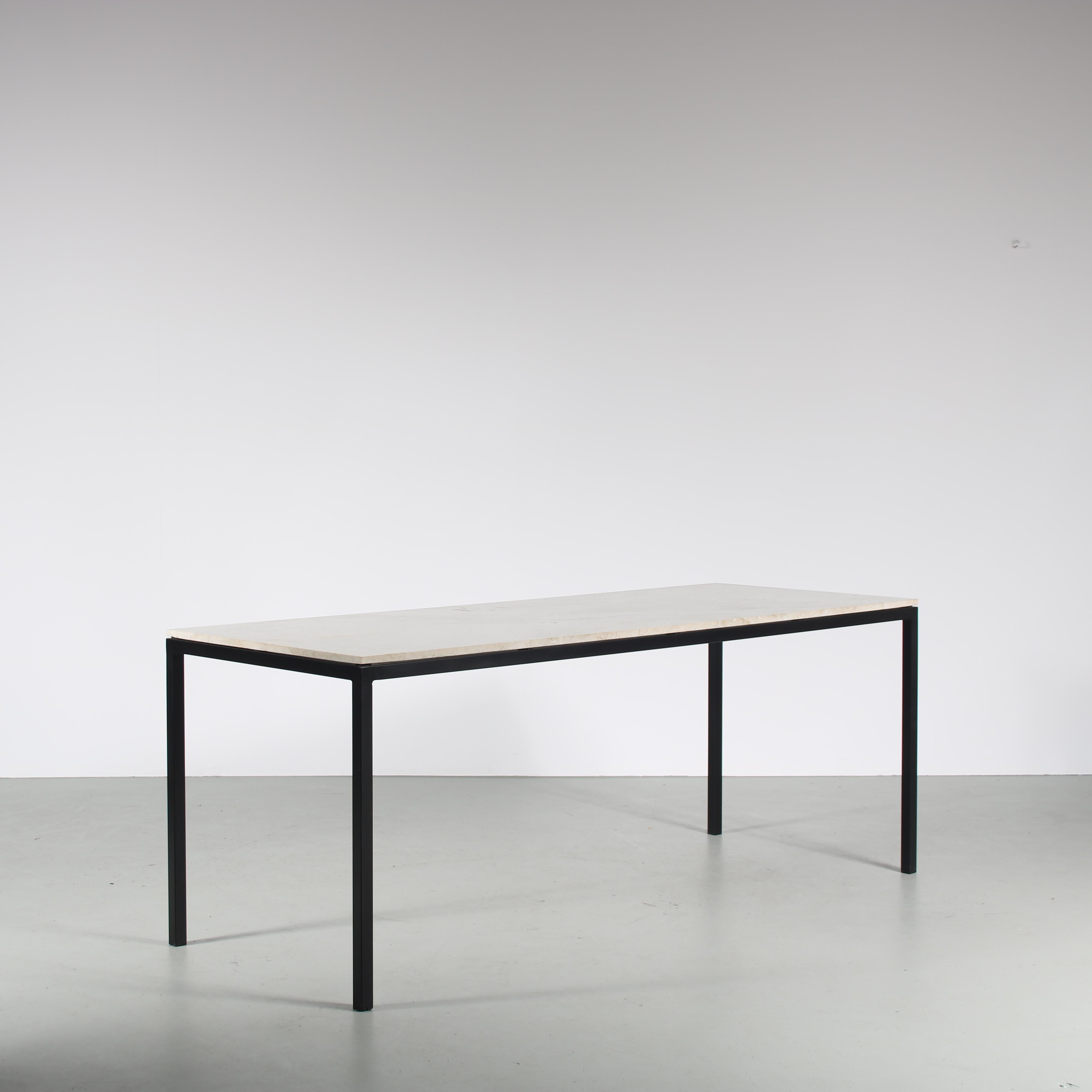 A luxurious, modern dining table in the style of Florence Knoll, manufactured around 1950.

The piece has a minimalist design with rectangular, black lacquered metal base and a beautiful quality marble top. This combines into a very luxurious
