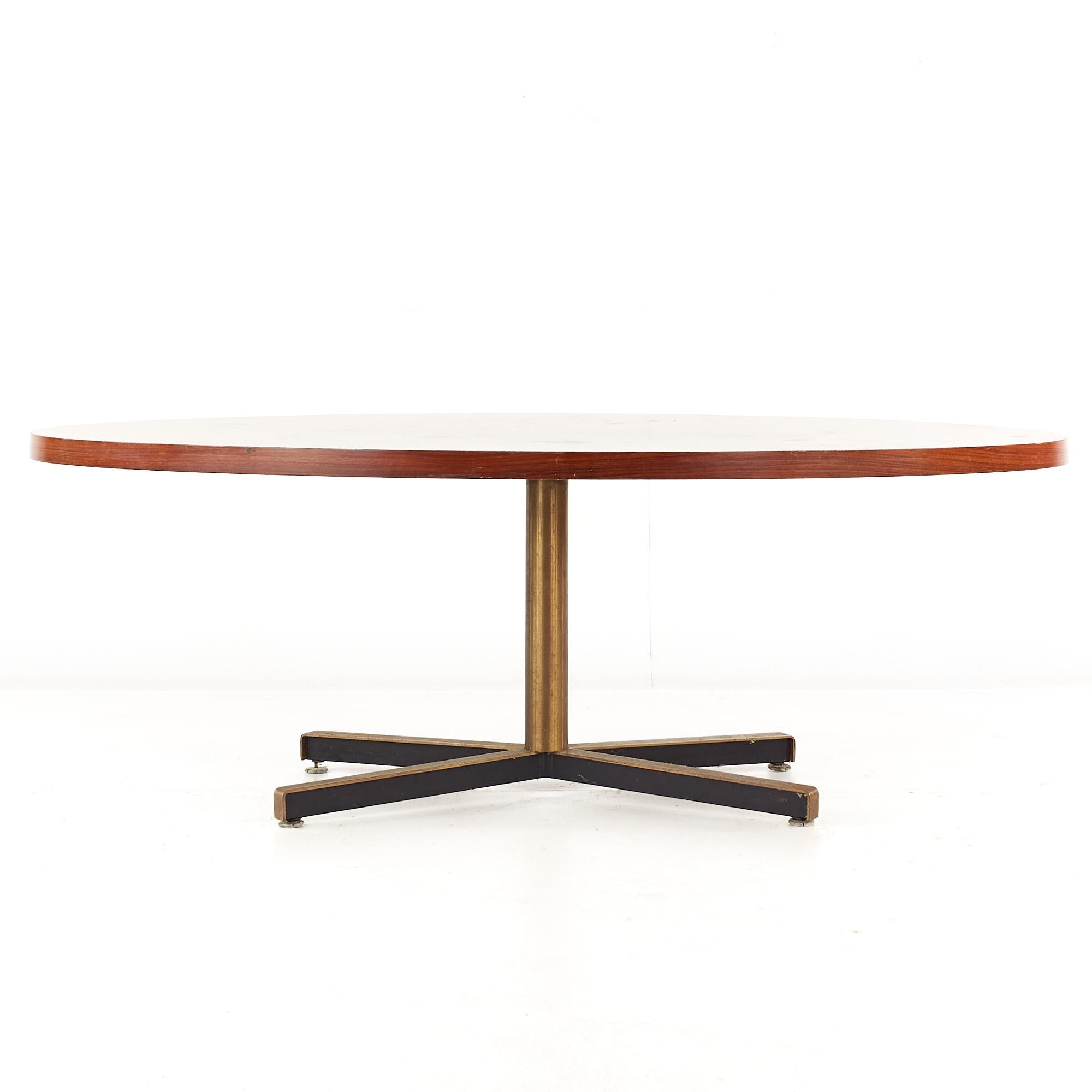 Florence Knoll Style Mid Century rosewood and brass dining table.

This dining table measures: 84 wide x 42 deep x 28.5 high, with a chair clearance of 26.25 inches.

All pieces of furniture can be had in what we call restored vintage condition.