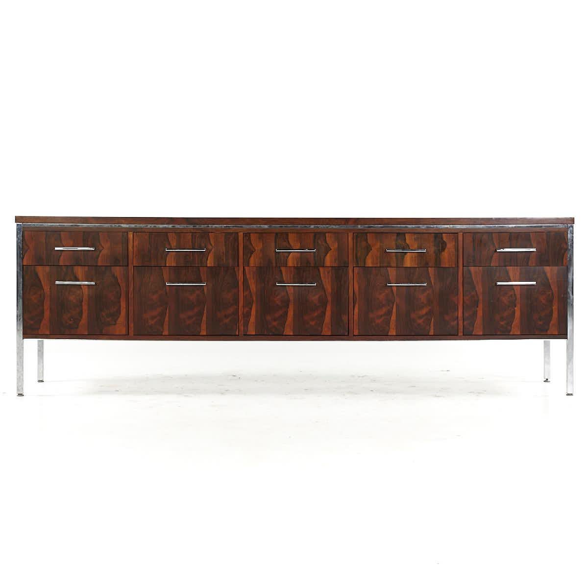 Florence Knoll Style Mid Century Rosewood and Chrome File Credenza

This credenza measures: 90.75 wide x 18 deep x 29.25 inches high

All pieces of furniture can be had in what we call restored vintage condition. That means the piece is restored