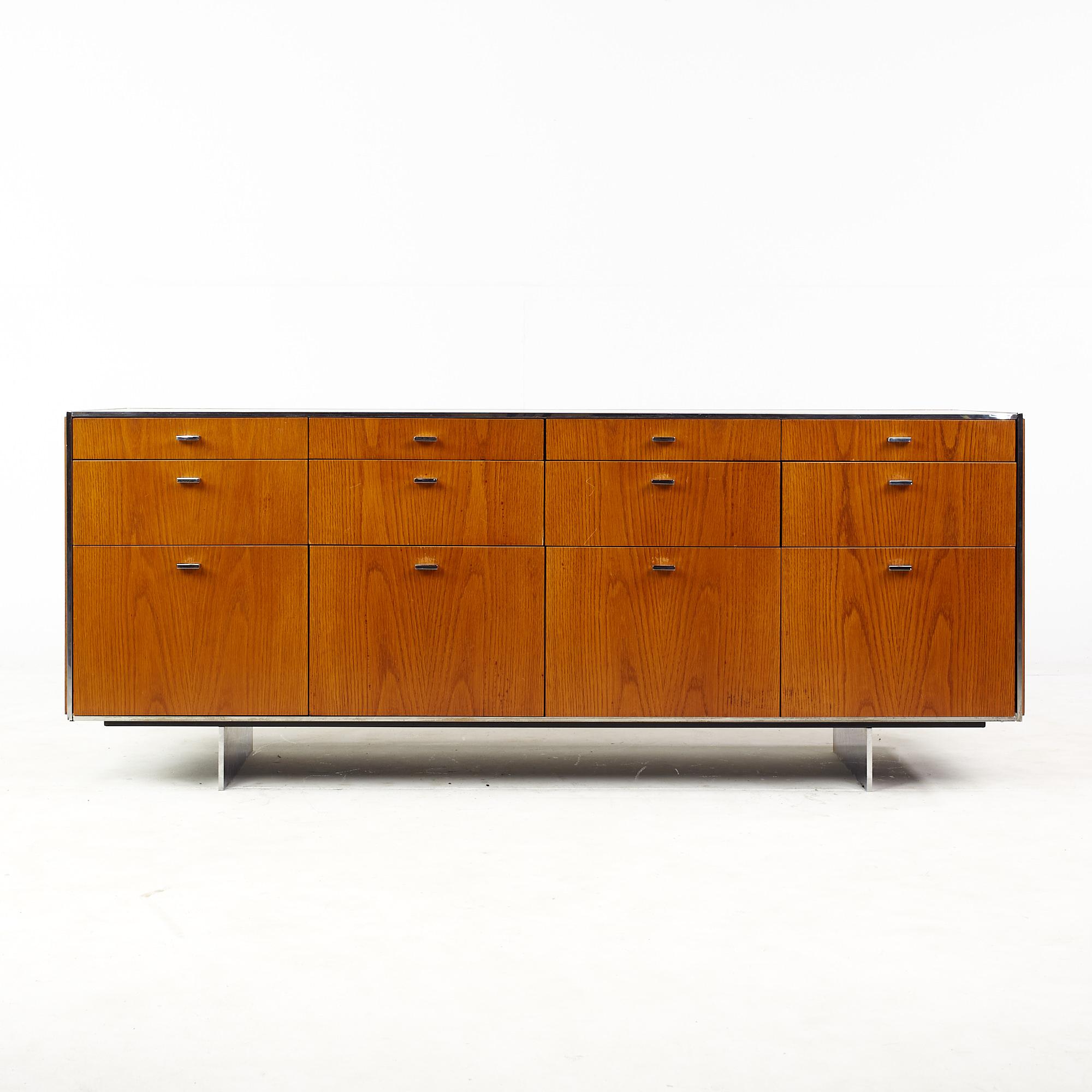 Florence Knoll style mid century walnut and chrome credenza

This credenza measures: 65 wide x 21.5 deep x 26.5 inches high

All pieces of furniture can be had in what we call restored vintage condition. That means the piece is restored upon