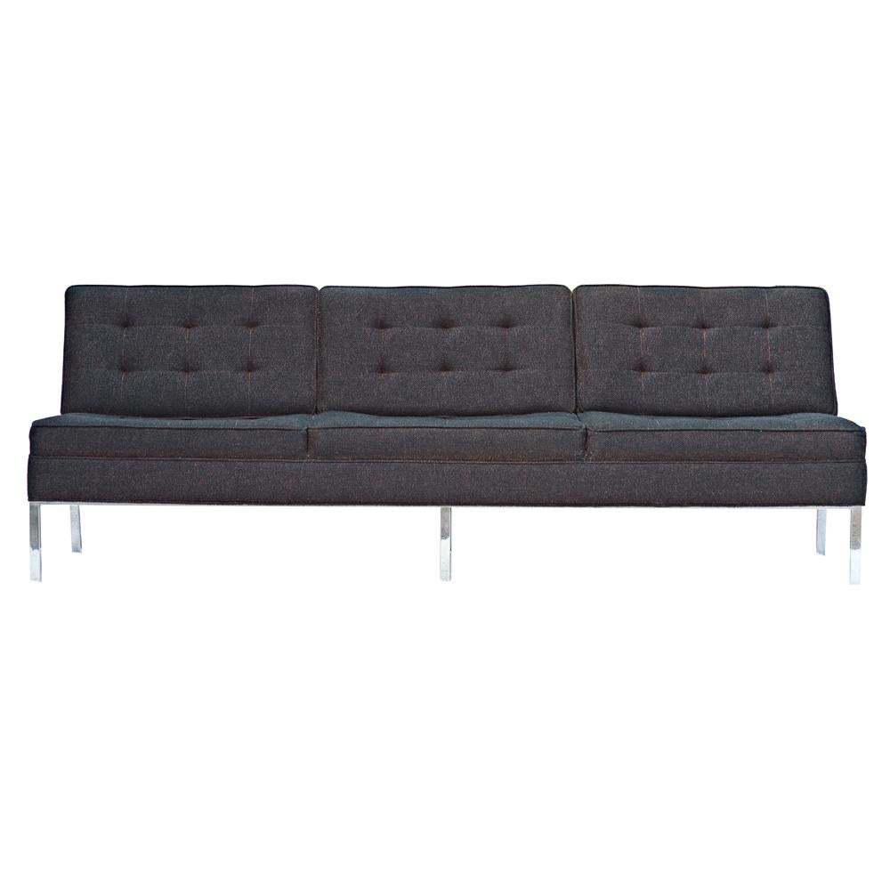 A mid century modern sofa made by Steelcase in the manner of Florence Knoll.  A chrome frame with charcoal gray tweed upholstery. 


Reupholstery recommended.