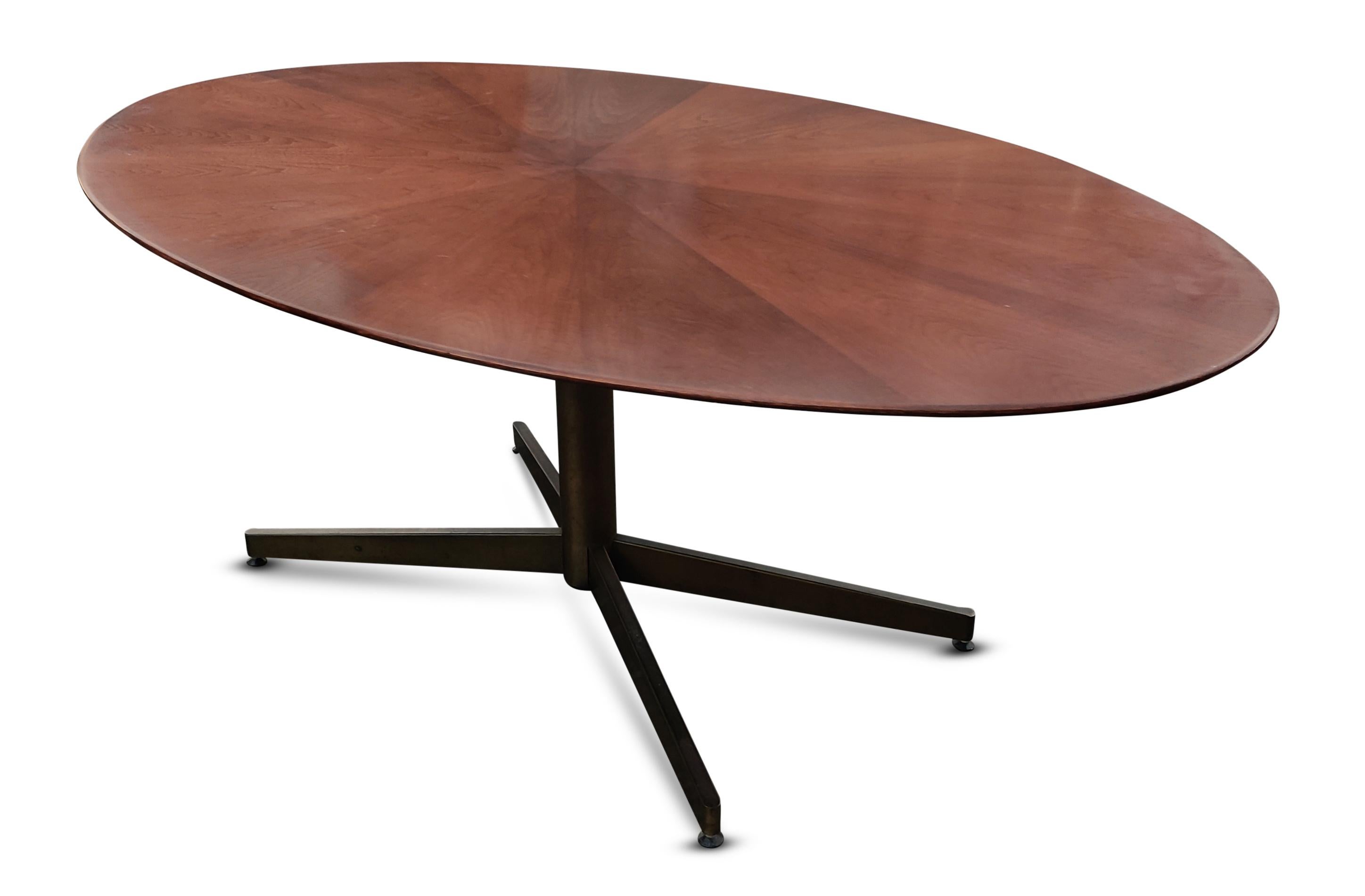This gorgeous midcentury table is incredibly practical. Because of its dimensions and purposeful design, it can serve as a dining table, a conference table, or as a majestic desk. The oval top, which is 1, 1/4 inch thick, has many alluring design