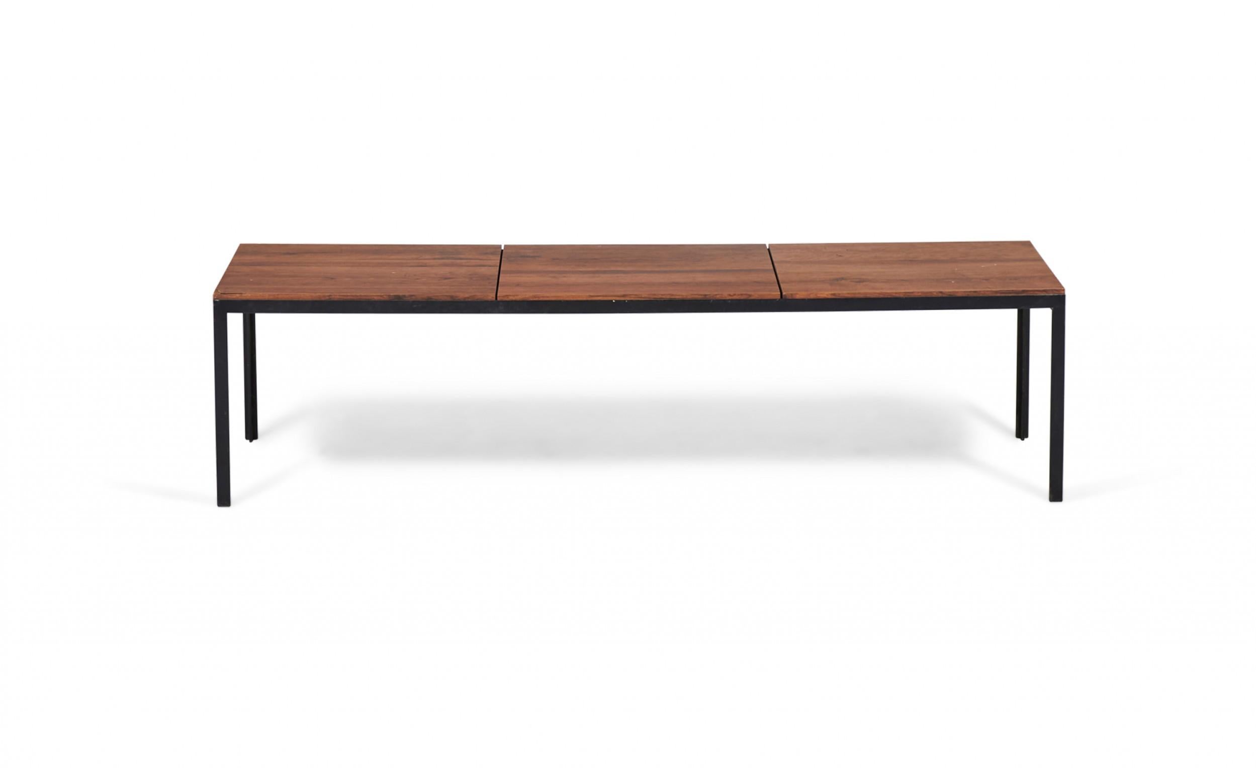 American Mid-Century rectangular coffee / cocktail table with a walnut laminate top in three sections supported on a T-shaped black metal base. (FLORENCE KNOLL)(Similar table: DUF0082).