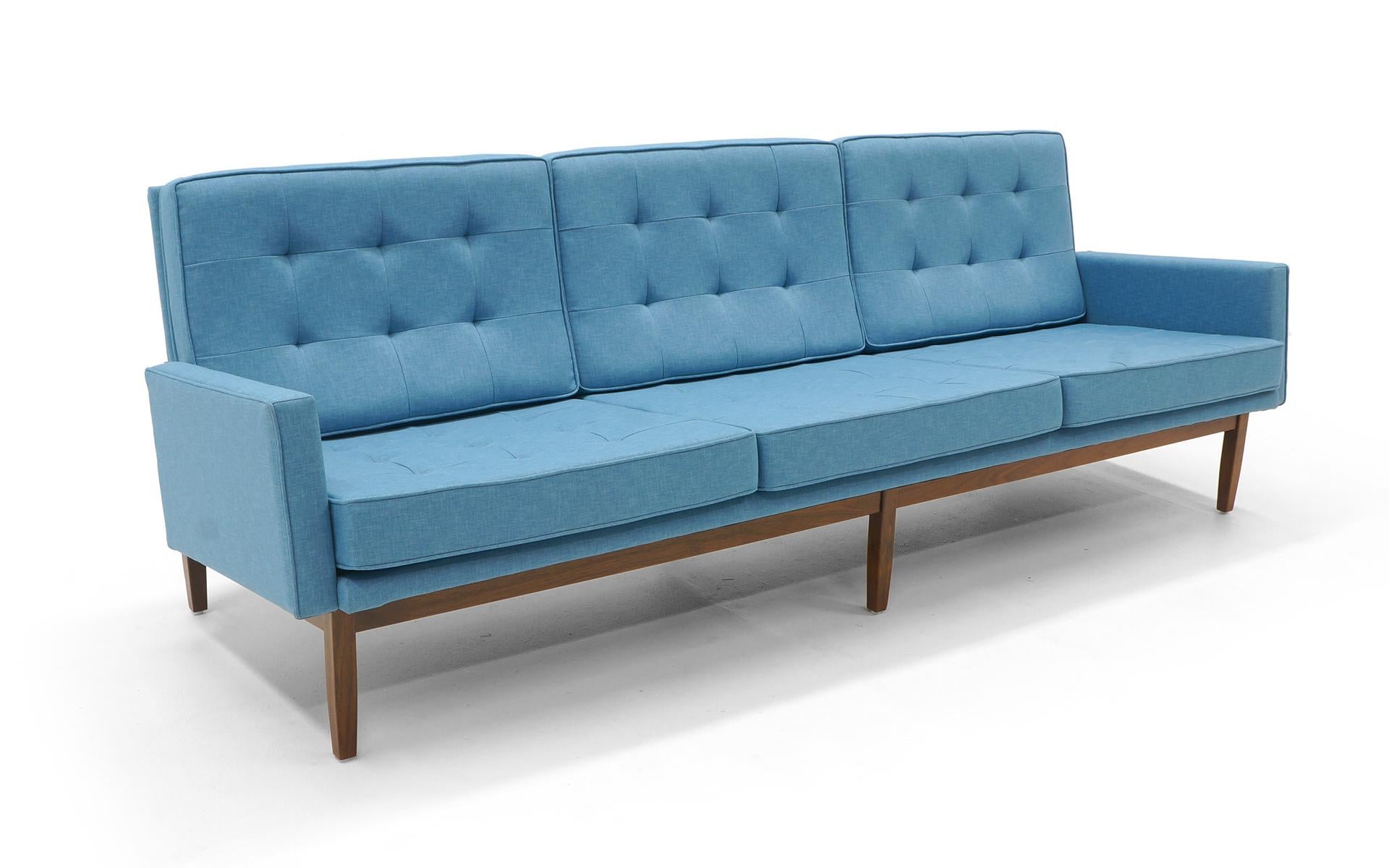 Classic florence Knoll tufted back sofa with the highly desirable walnut frame. Beautiful light blue color expertly restored and reupholstered. Excellent in every way.