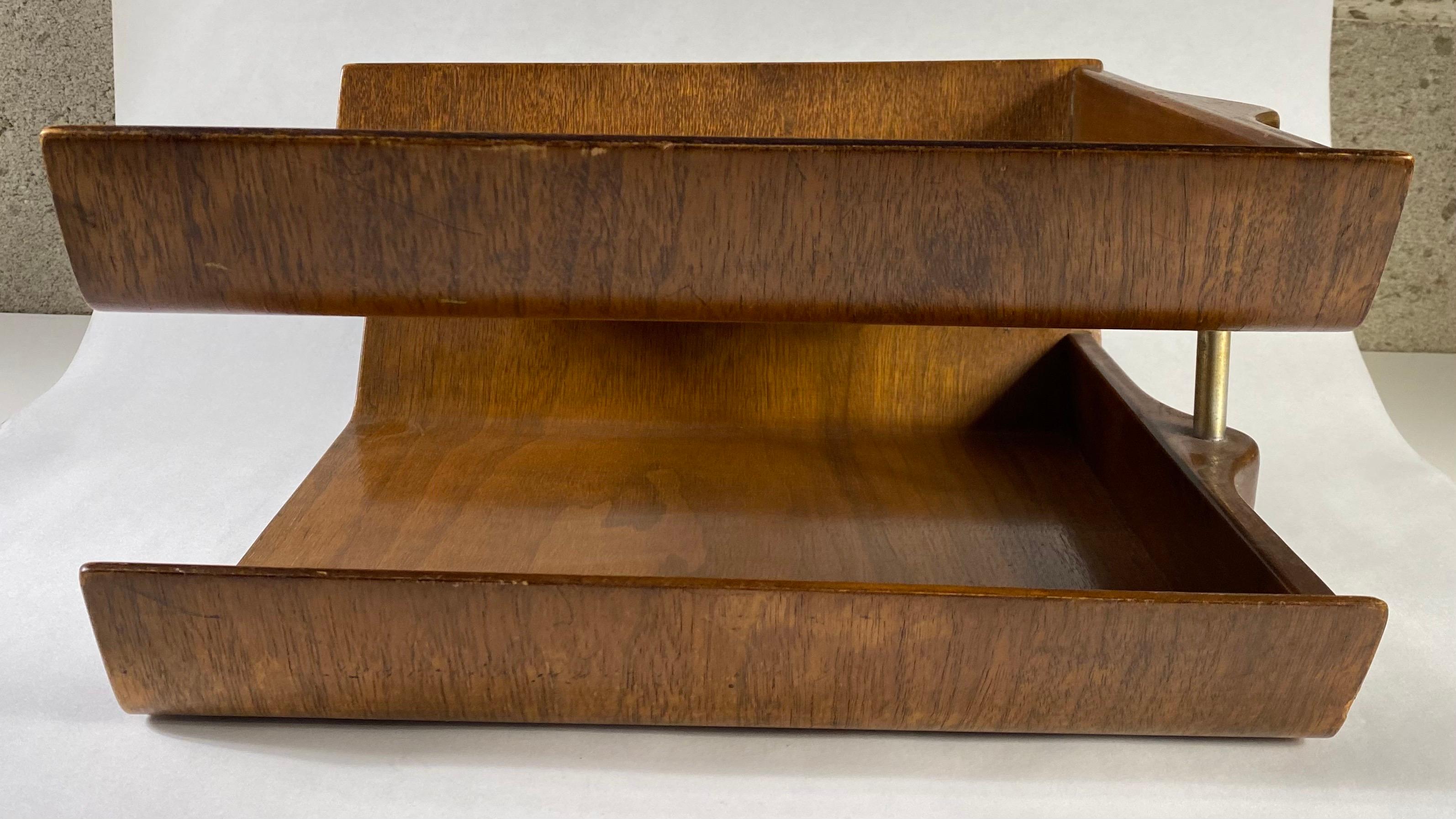 A two- tier paper filing desk organizer by Florence Knoll.