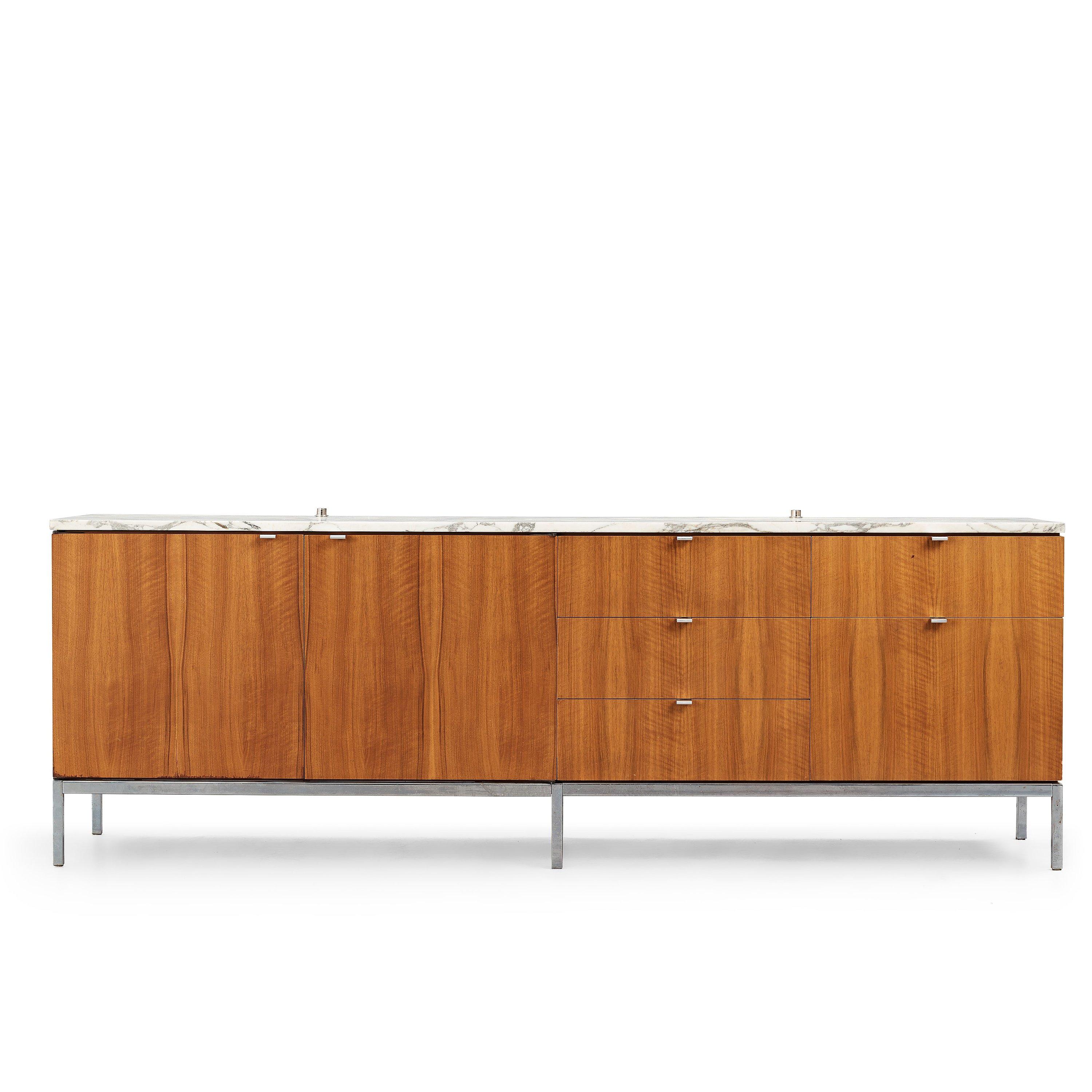 Sideboard designed by Florence Knoll for Knoll International, executed on license by Nordiska Kompaniet NK Inredningar, Sweden, 1966.

Front and back venered in walnut, marble top, handles and base in chrome plated metal, interior in oak, locks