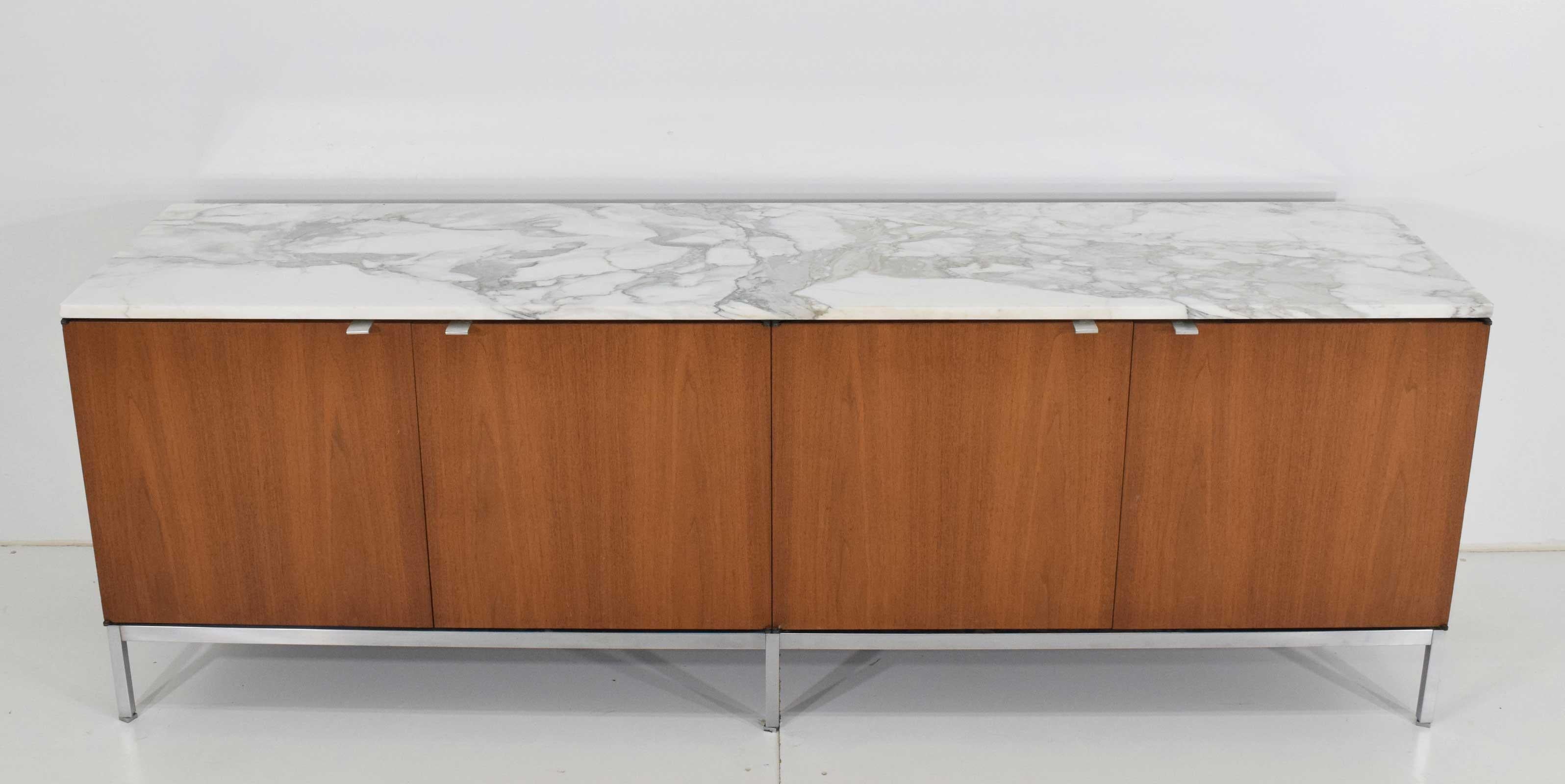 Beautiful credenza from 1960s by Florence Knoll. Carrera marble top. Plenty of shelf storage below.