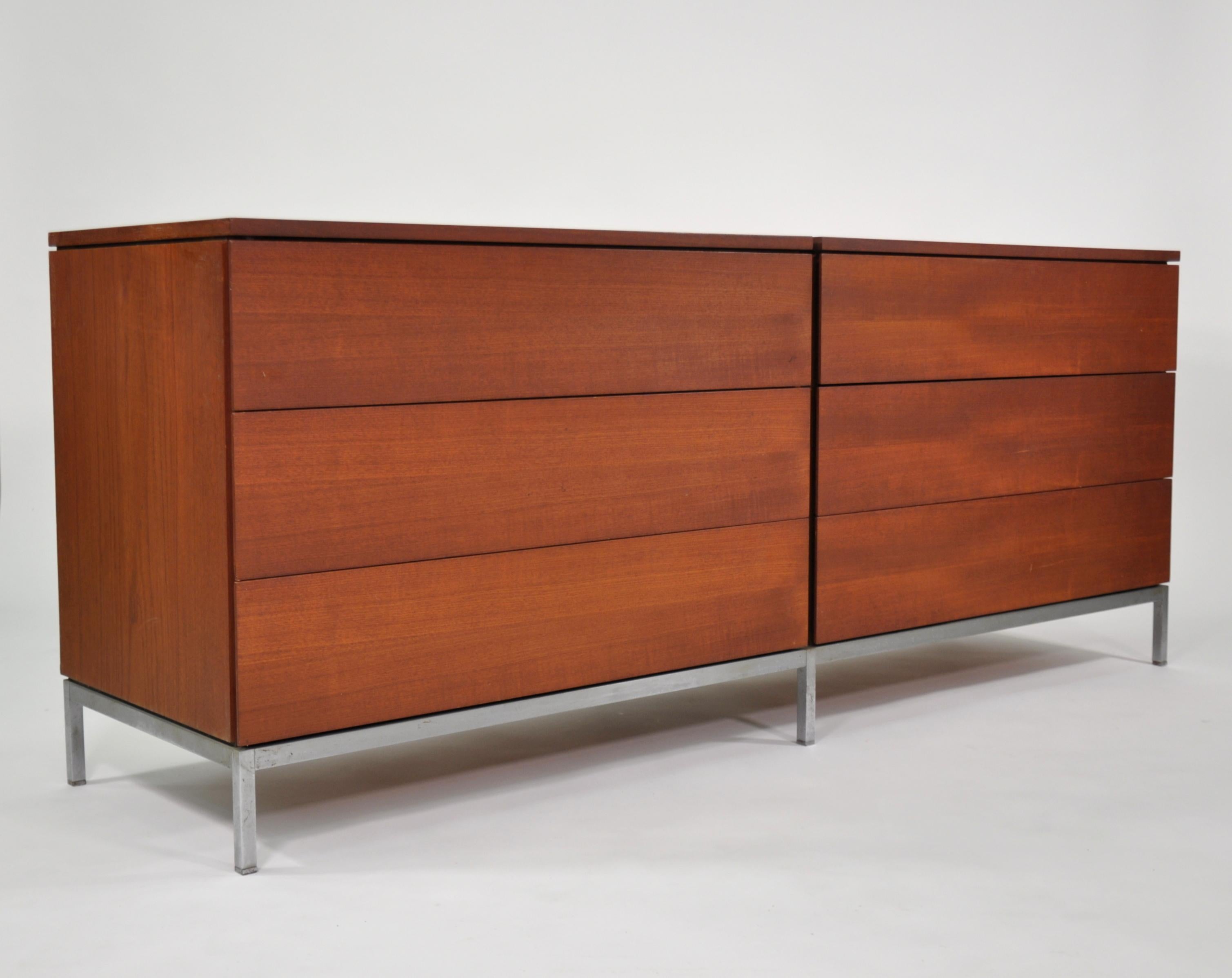 A Minimalist Mid-Century Modern walnut and chrome double dresser designed by Florence Knoll for Knoll Associates, dating from the mid 1950s. The vintage chest features six large maple drawers, four with dividers; the whole is raised on a chromed
