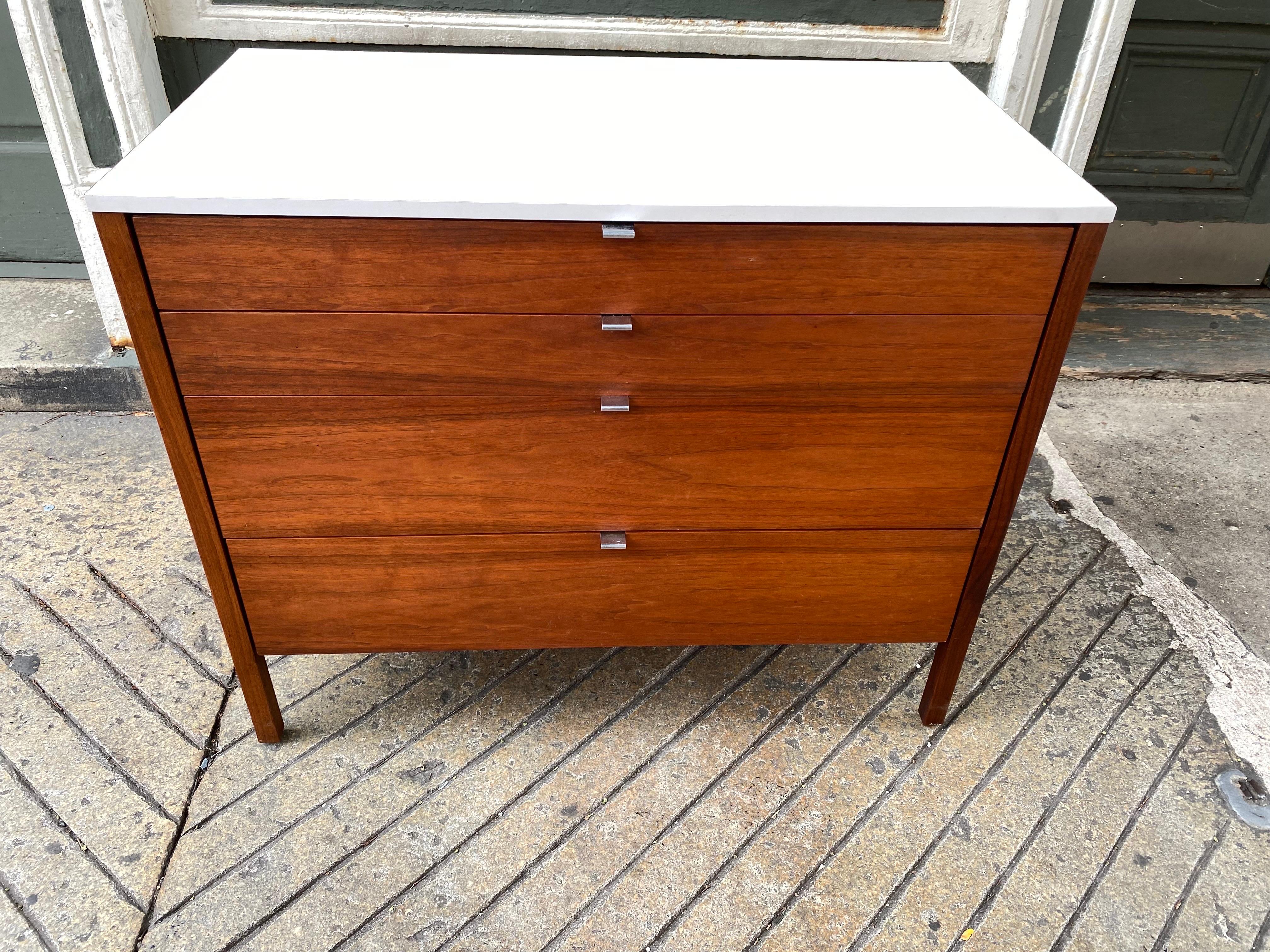 Florence Knoll for Knoll walnut dresser with white formica tops. All original condition! 4 walnut drawers with chrome center flat handles. Clean simple design blends in anywhere! Matching nightstands available in separate listing! Two Dressers