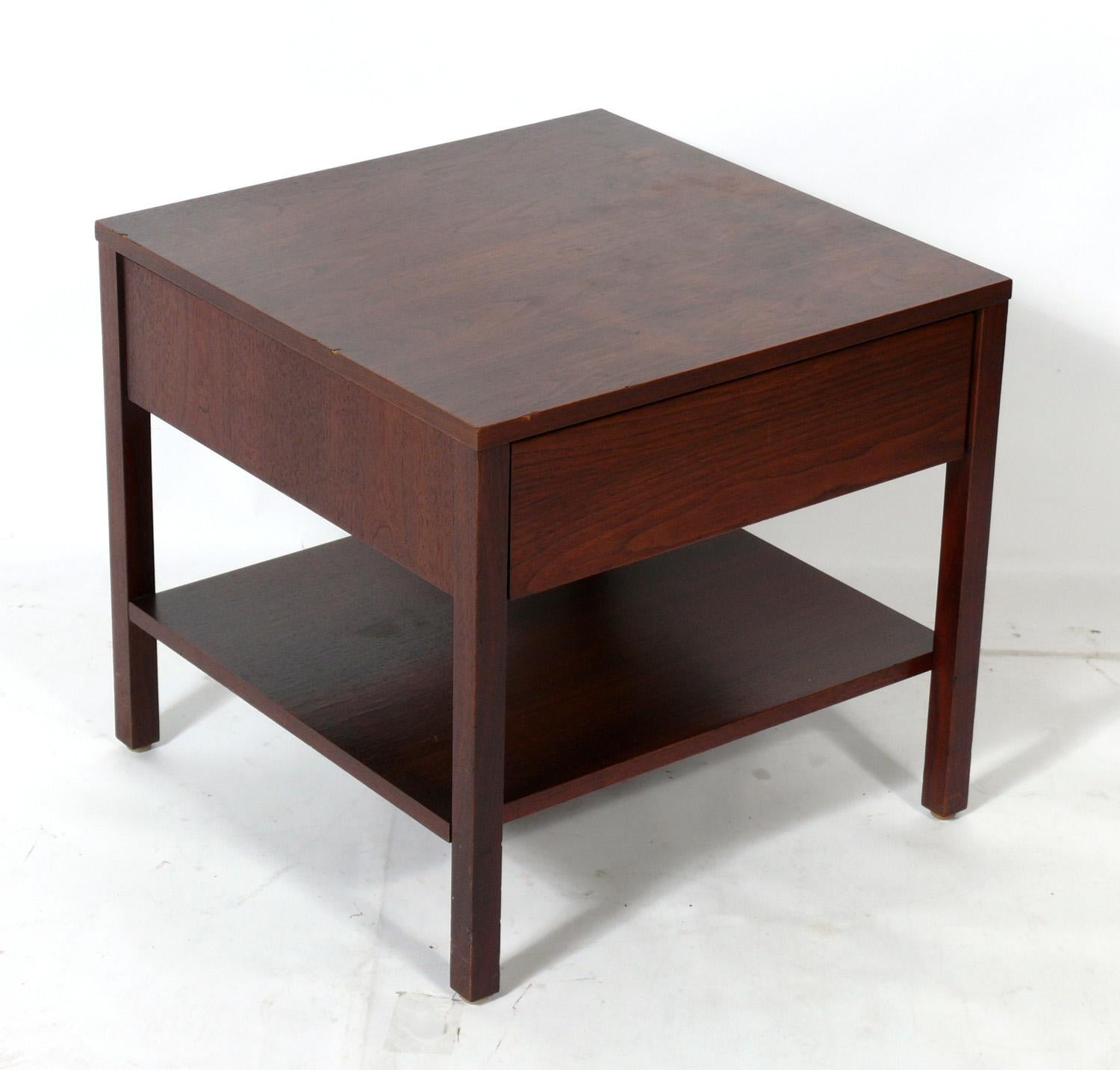 Pair of clean lined walnut night stands or end tables, designed by Florence Knoll for Knoll, American, circa 1950s. They have been cleaned and Danish oiled and are ready to use.