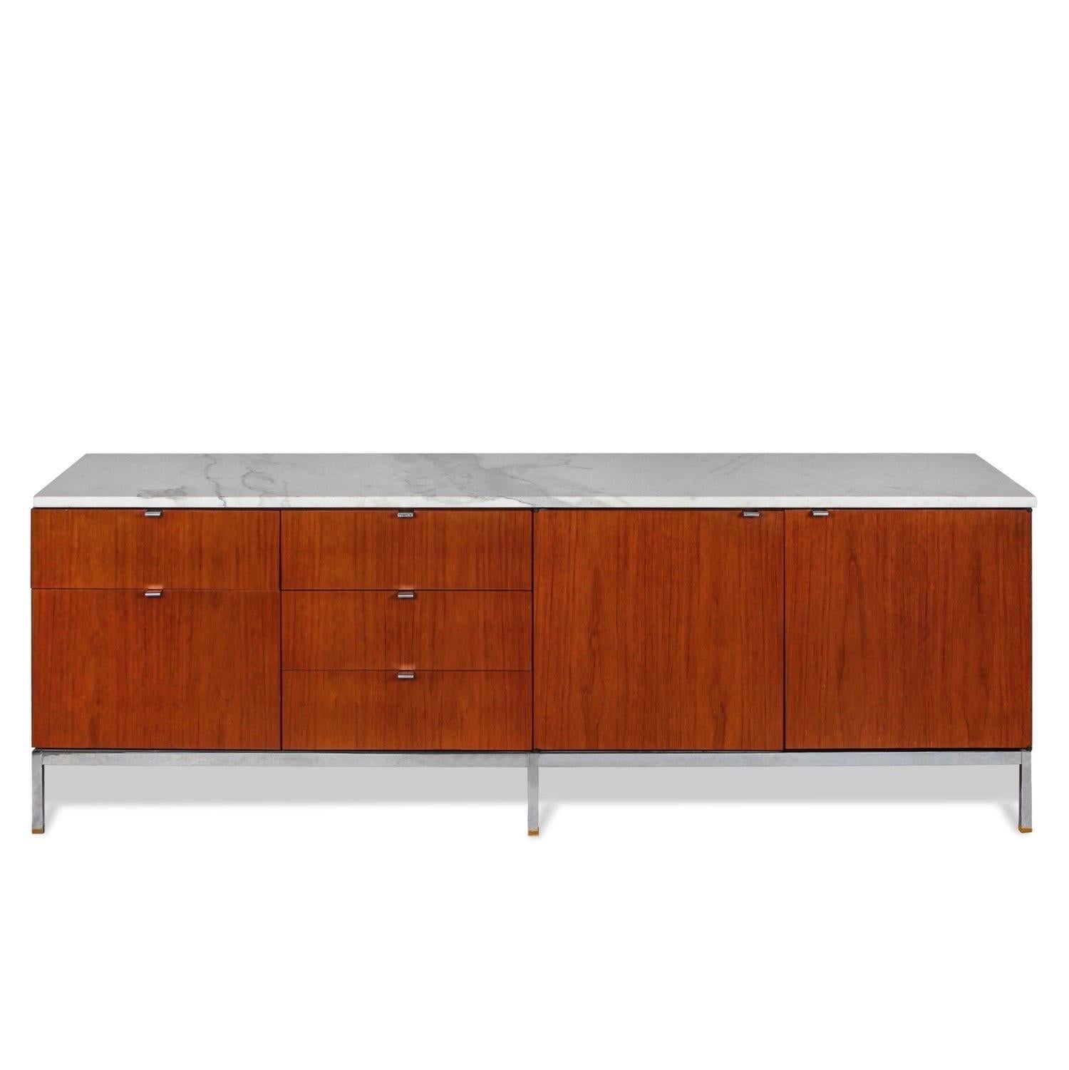 Florence Knoll credenza produced by Knoll Studio. USA, circa 1980.

Features a wood case, stainless steel legs and marble top. Includes drawer and cabinet configuration.

Dimensions: 75.5” L x 18” D x 25.5” H.