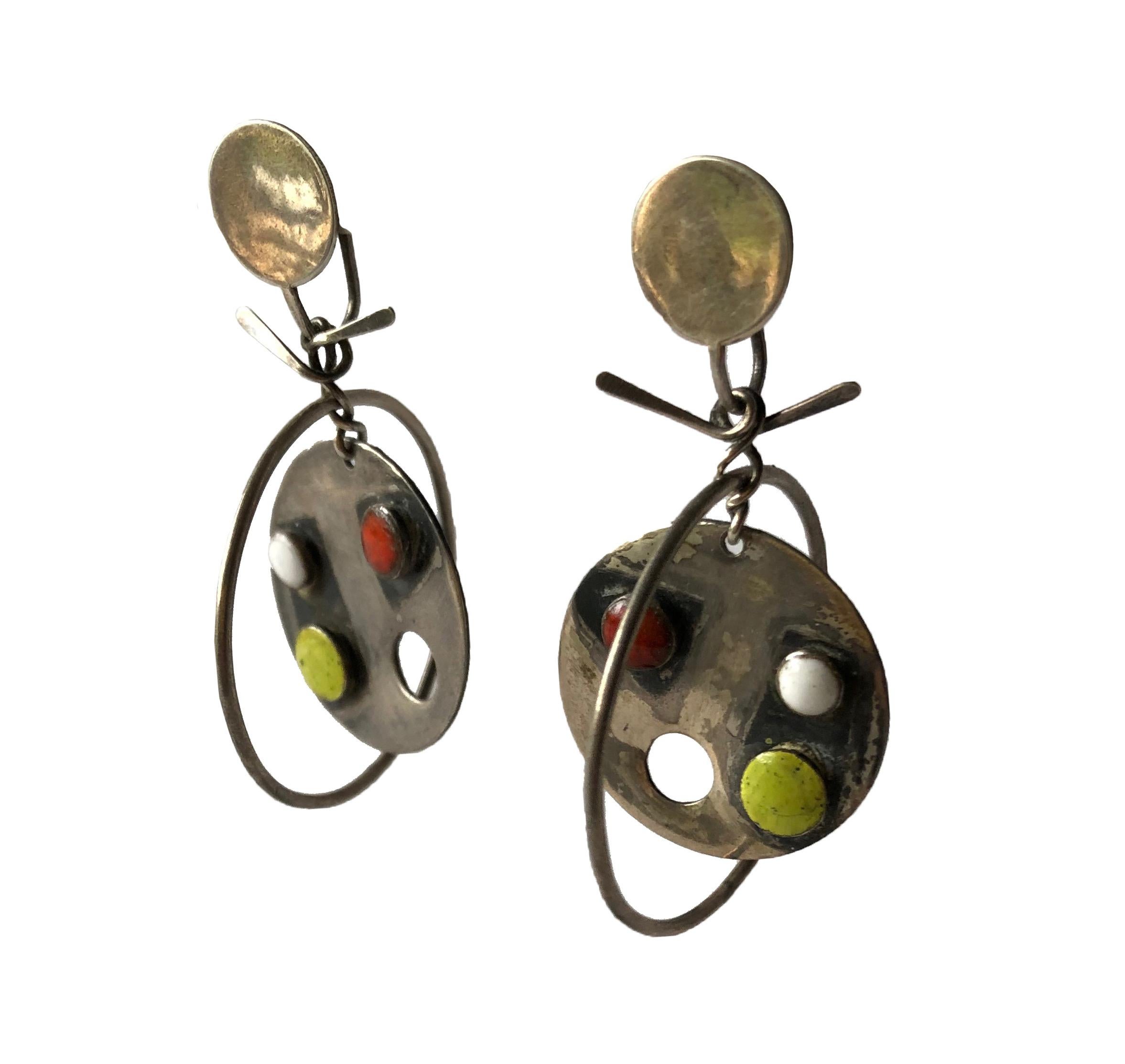 Kinetic sterling silver and enamel earrings created by Florence Reznikoff of Oakland,  California.  Earrings measure 2