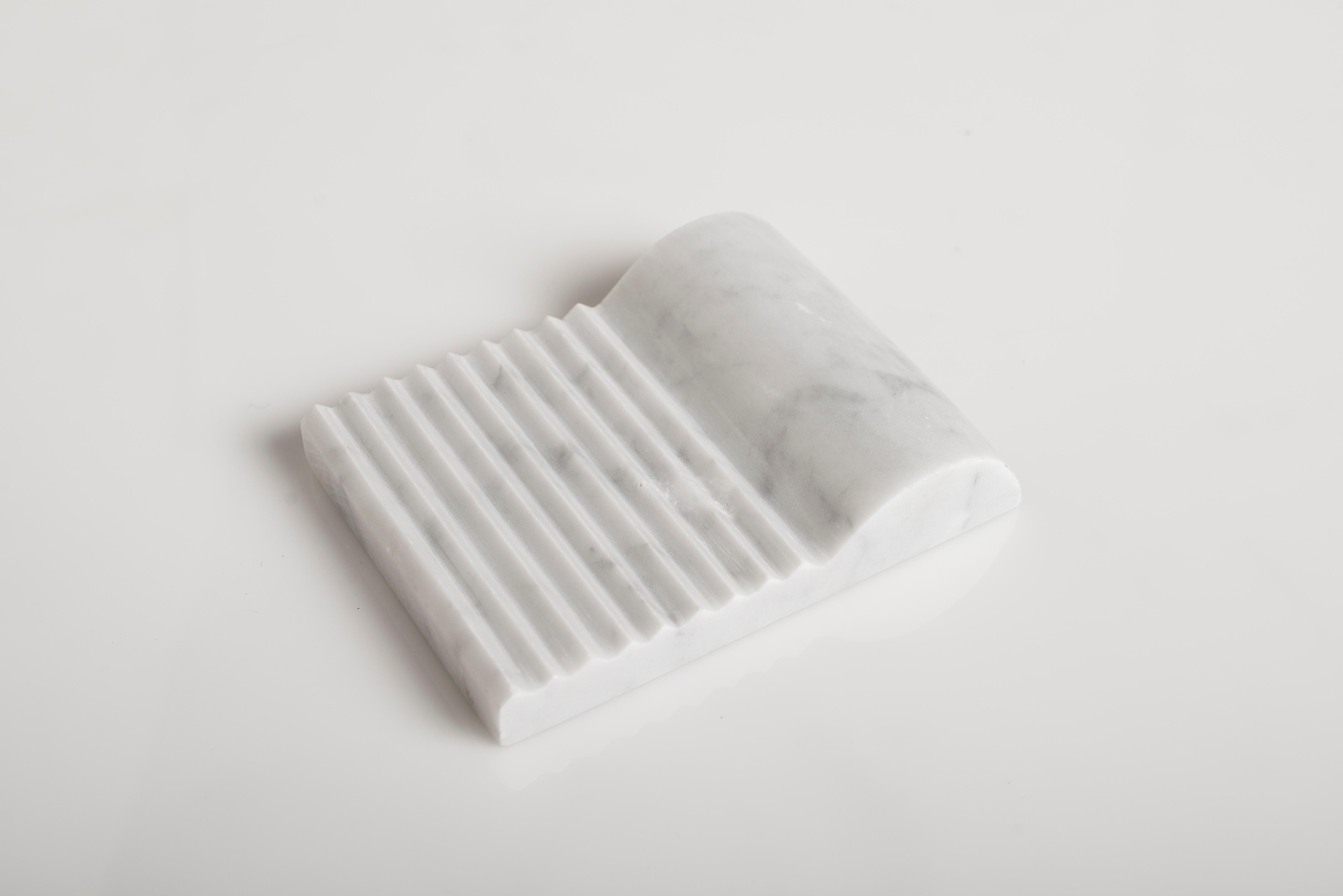 Florence sculpture by Carlo Massoud
Handmade 
Dimensions: D 15 x W 12 x H 3.5 cm 
Materials: Carrara Marble

Carlo Massoud’s work stems from his relentless questioning of social, political, cultural, and environmental norms. He often pushes his