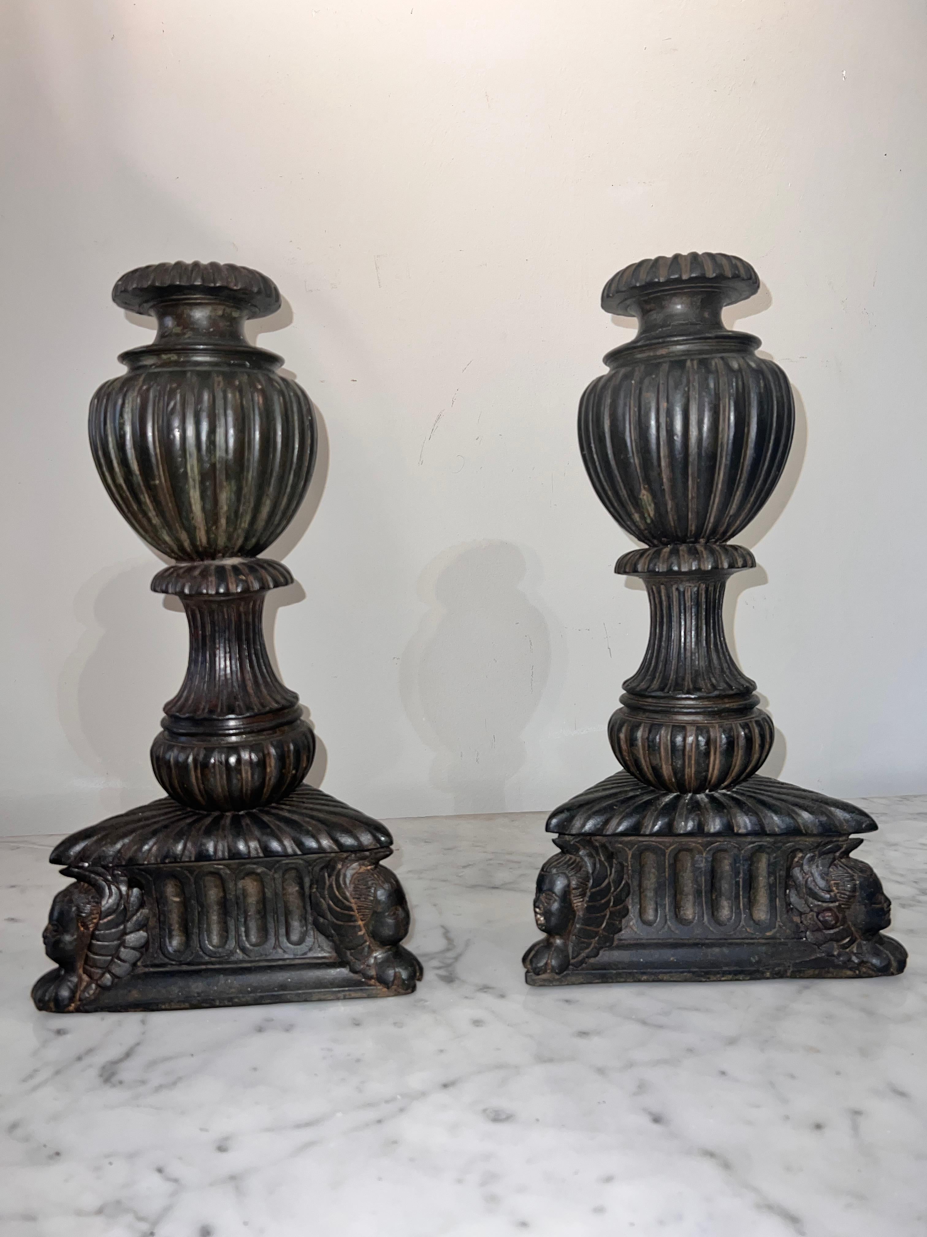 Beautiful pair of bases for church candlesticks in burnished bronze, baluster-shaped with pods, triangular base with Cherub head details. Bases weighted with stucco.
Florentine manufacture of the 16th century.