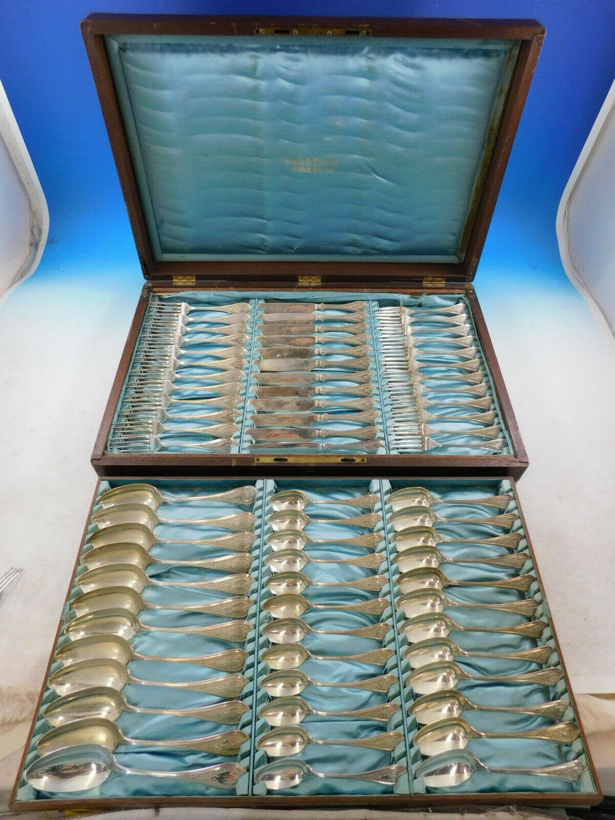 Rare Florentine by Wendt circa 1870 sterling silver Flatware set in fitted box - 72 pieces. This Moorish/Persian style features a background with a complex design of foliage-like scrollwork. This set includes:

12 Knives, flat handle all-sterling,