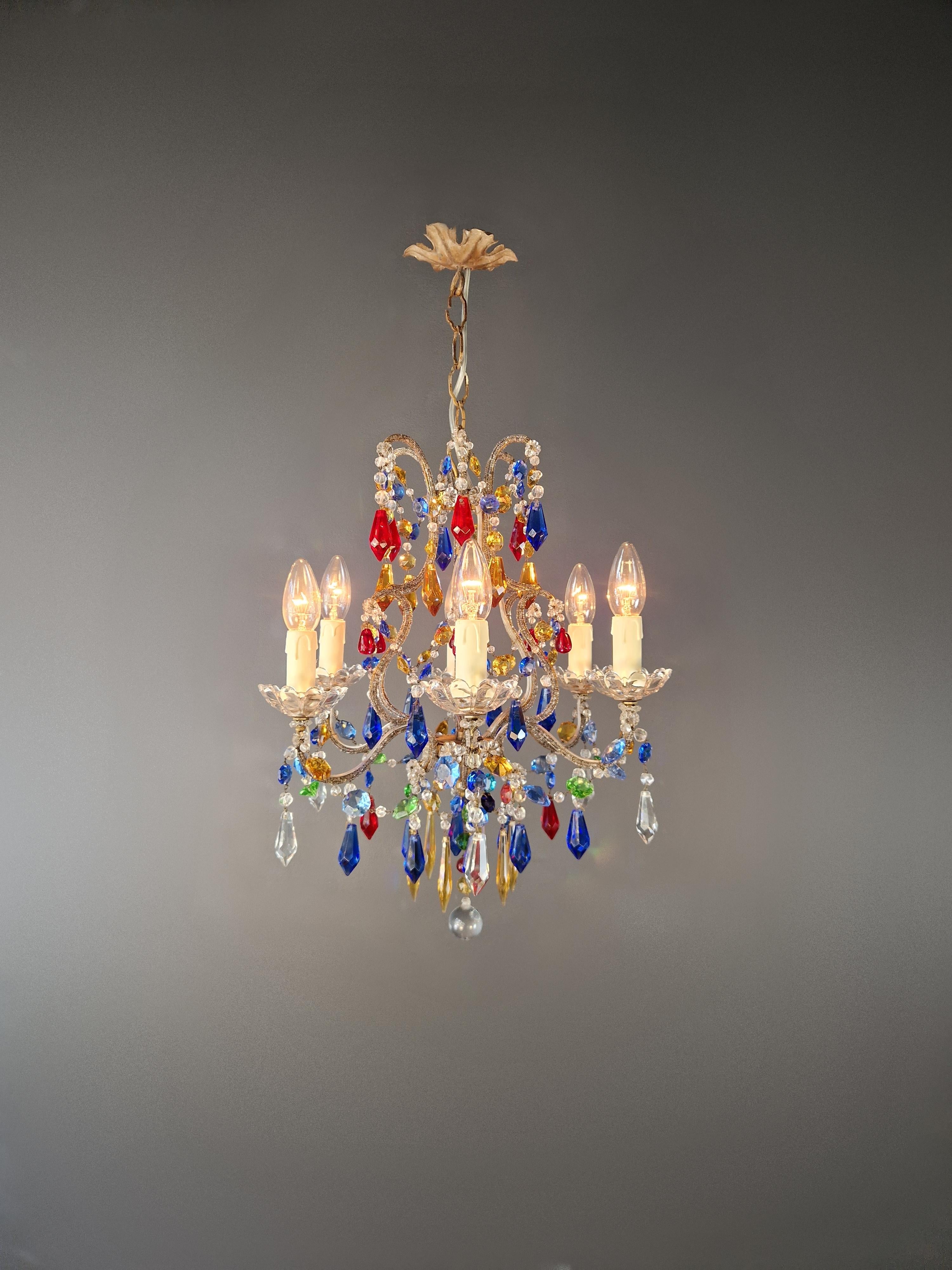 Florentine Gilded Iron Chandelier with Colored Crystals Italy, circa 1950

A striking Florentine chandelier from the mid-20th century, crafted in Italy around 1950, and beautifully restored to its original charm.

The gracefully curved frame, made