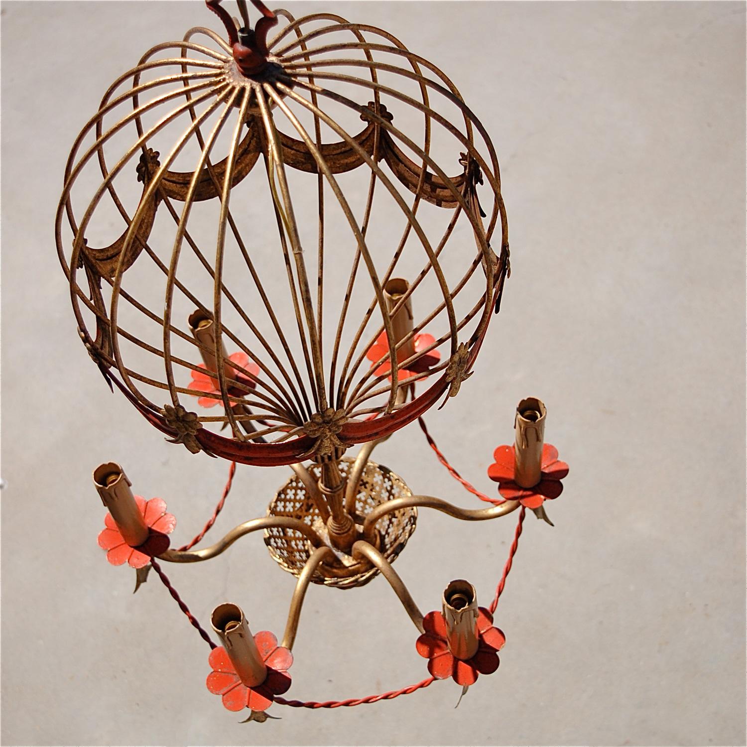 Gilt, ormolu chandelier or pendant lamp crafted in the style of a hot air balloon. An original, traditionally made Florentine ceiling light with fine detailing like petals, flowers, swags, bows, a basket and tassels all expertly crafted from gilt
