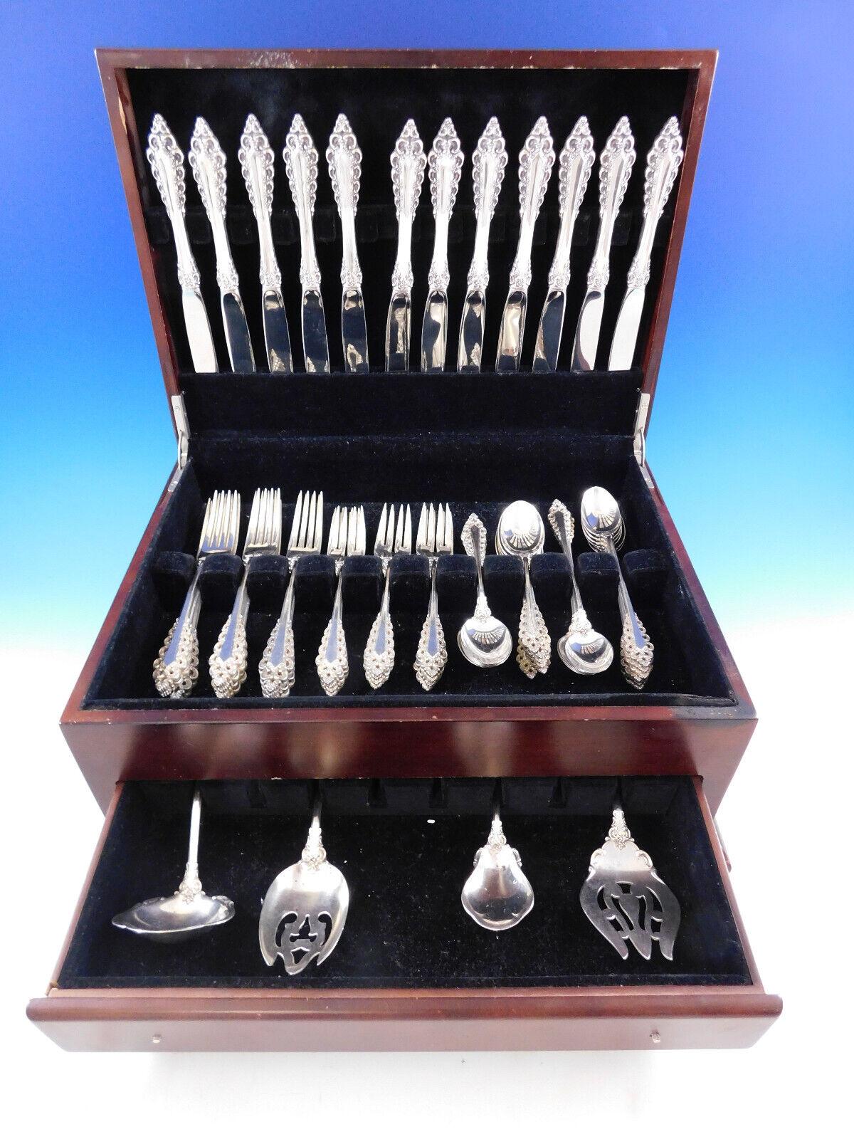 Florentine scroll by Lunt sterling silver flatware set, 64 pieces. This set includes:

12 knives, 9