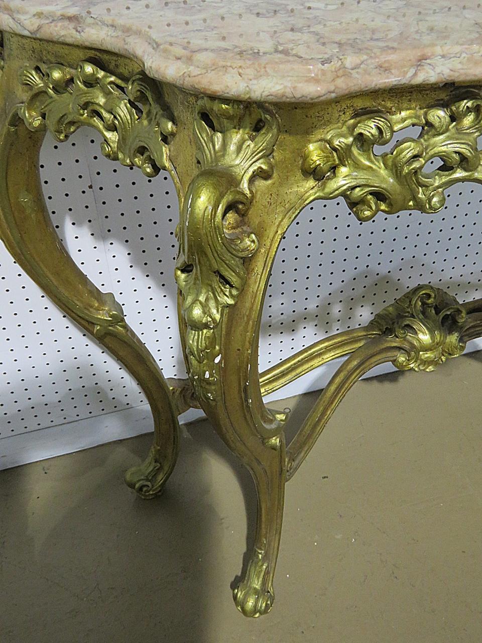 French Louis XV style marble top console table and a companion Chinese Chippendale mirror with distressed gilt. The mirror measures 48