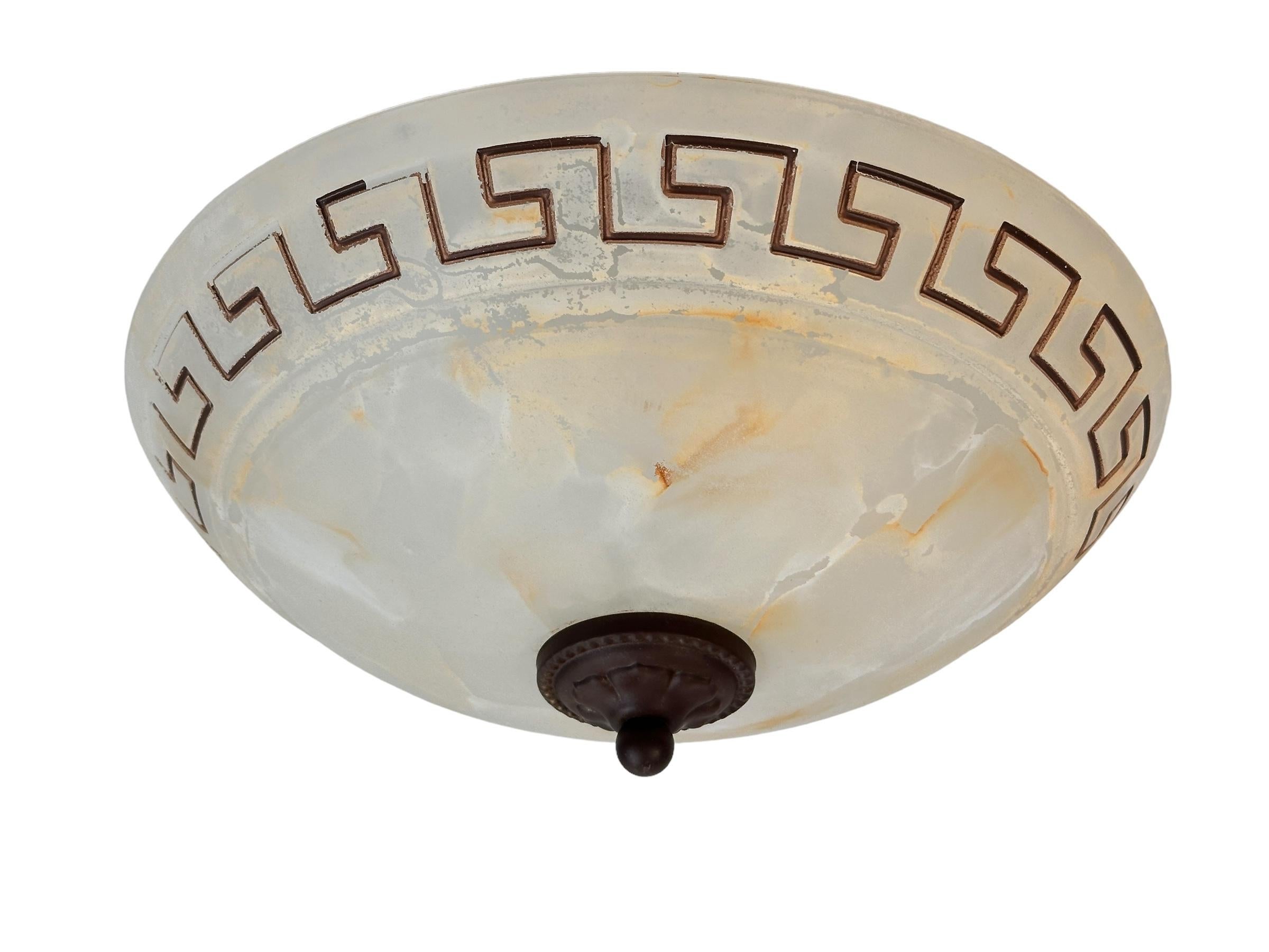 A beautiful Murano glass flush mount. Made by Brilliant Leuchten, Germany in Italy in the 1980s. Gorgeous textured glass flush mount with metal fixture. The Fixture requires one European E27 / 110 Volt Edison bulb, up to 60 watts. It is very