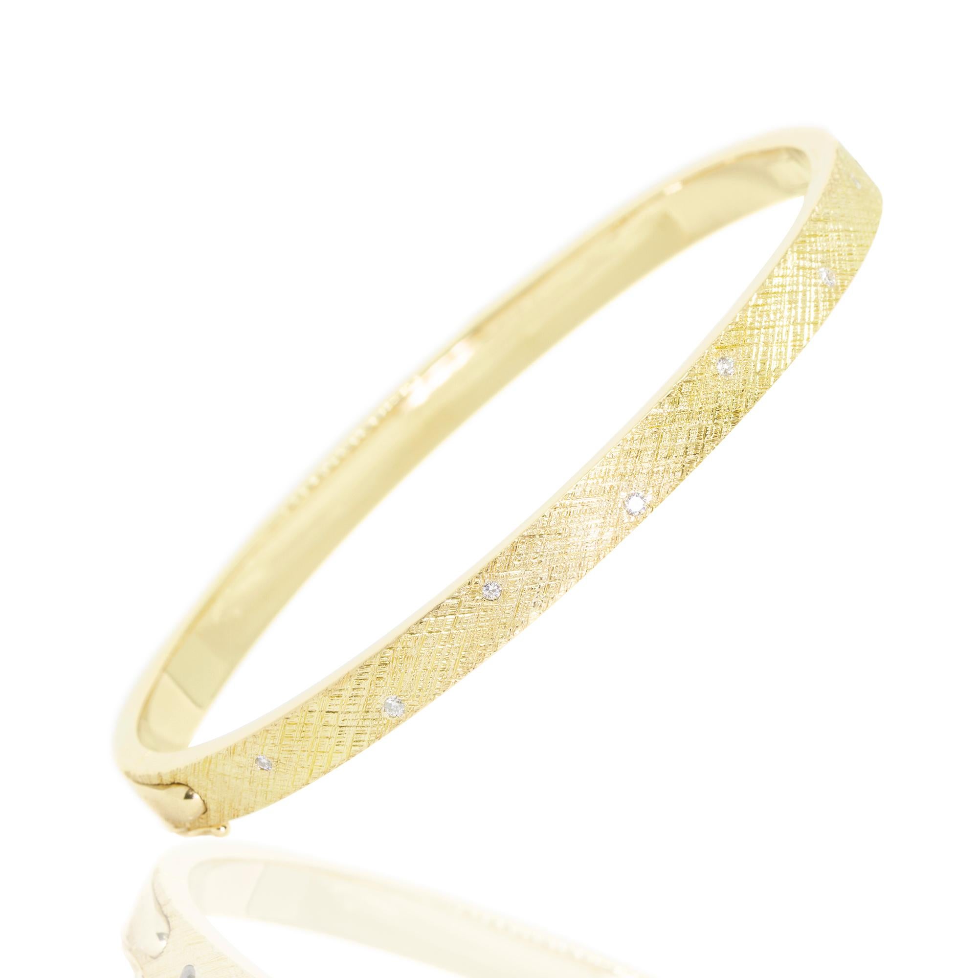 Defined by a hand-hammered crosshatch pattern with gorgeous shimmer and texture, the Florentine Gold Bangle pops with multi-colored tourmalines and diamonds and stacks beautifully with other styles from our collection. 

Stone carat: 0.3
Diamond