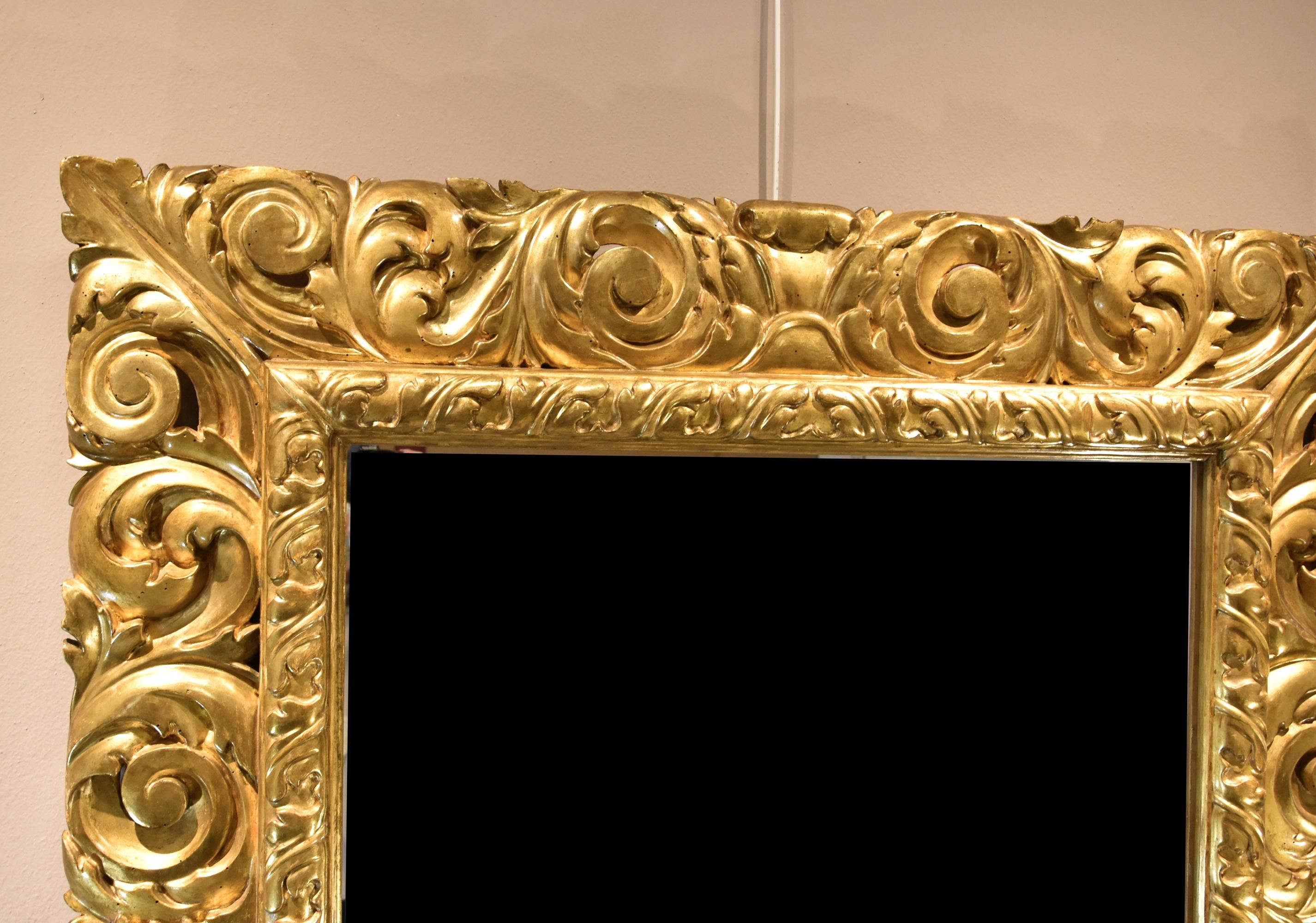Large mirror made by a Florentine woodcarver working in the early 18th century (it can be hung on the wall in either direction)  

Tuscany (Florence) 

Louis XIV style 

Carved and gilded wood  

Maximum dimensions: 135 x 119 cm. (mirror 94 x 79